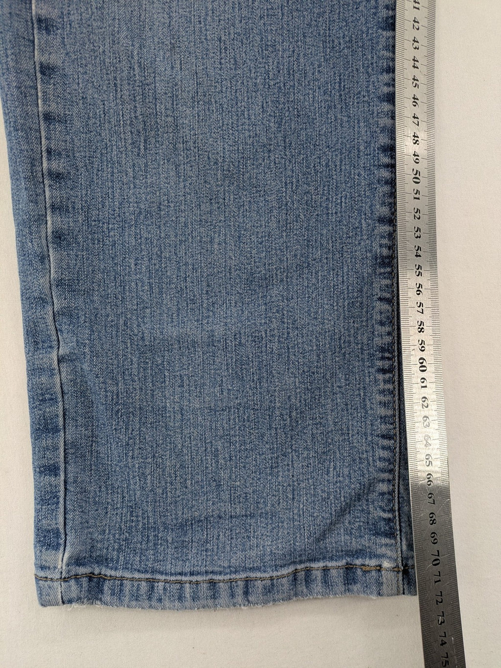 Digel blue straight jeans with classic medium wash and durable cotton denim material.