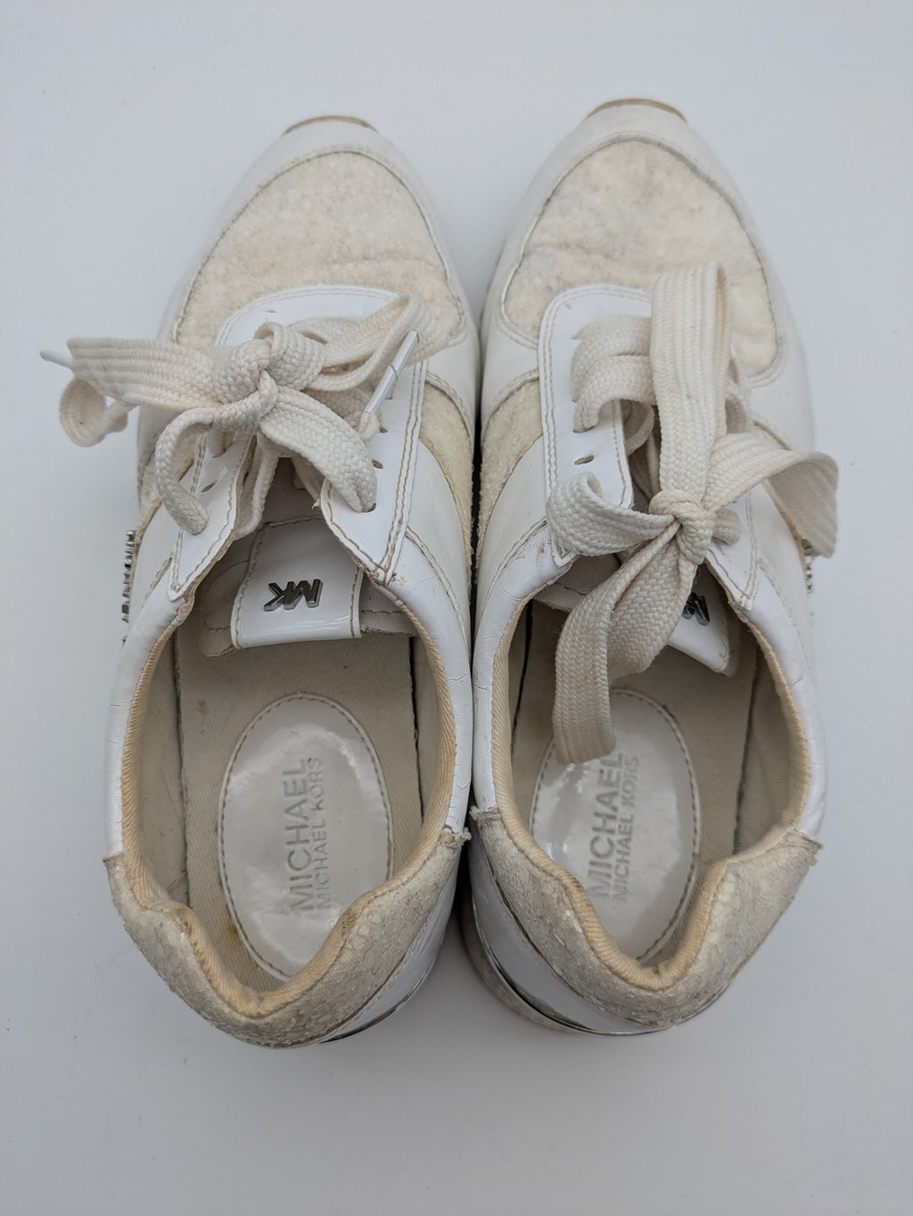Michael Kors multi sneaker white leather and cream textile with silver logo details.