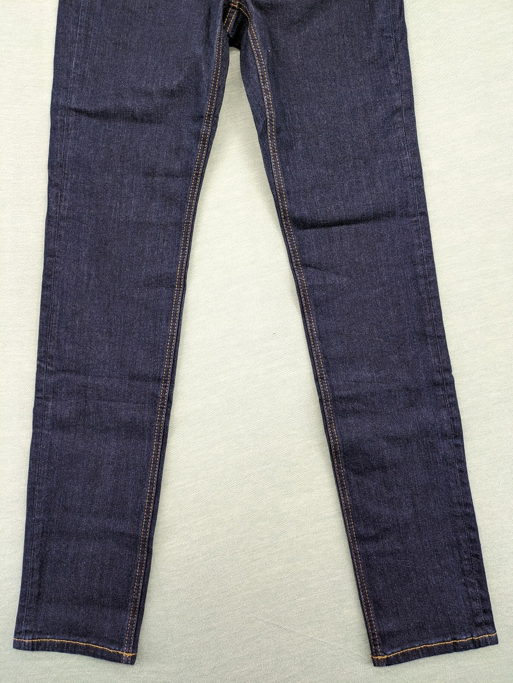 Esprit navy straight jeans with five-pocket style and yellow contrast stitching.