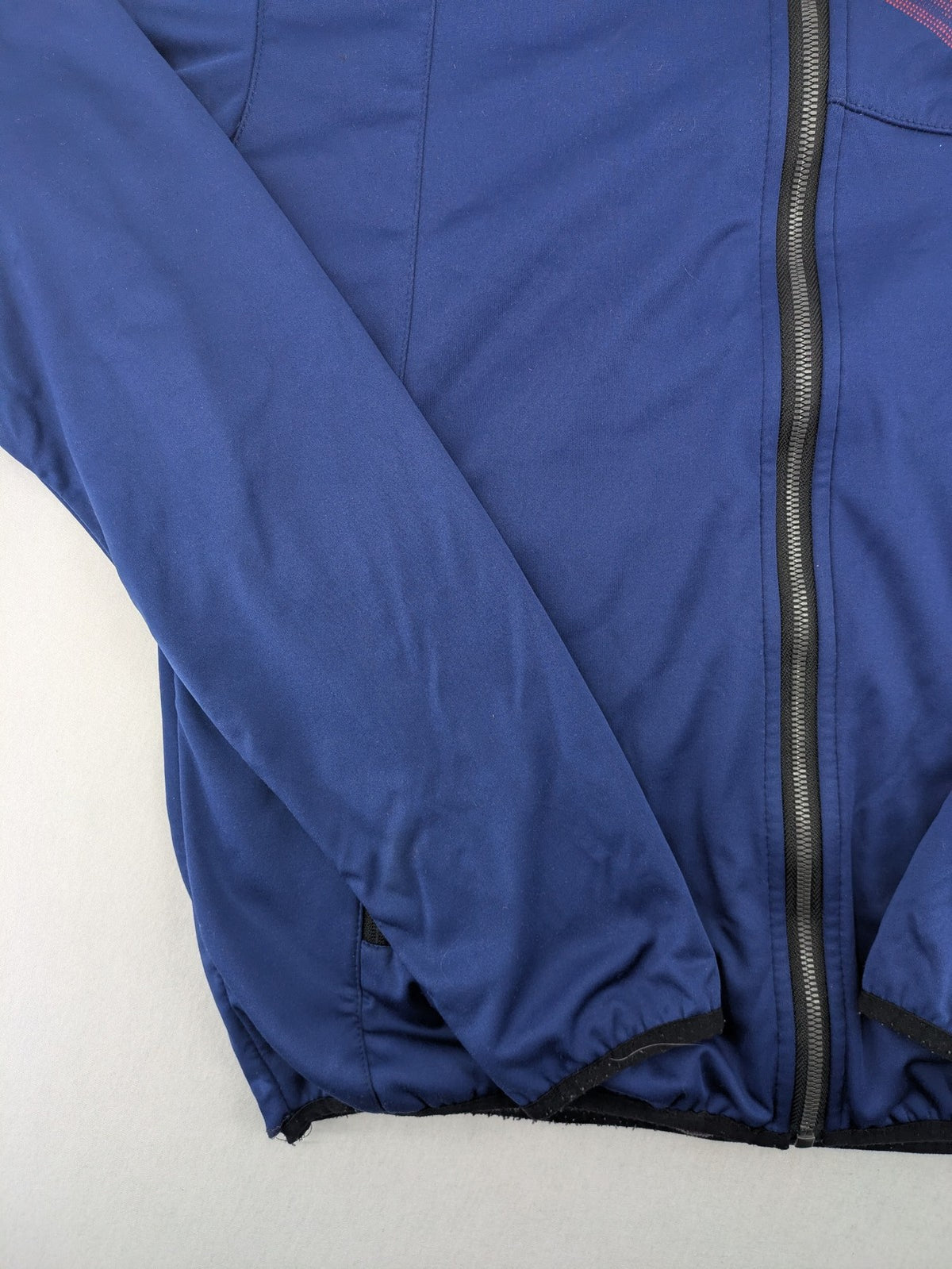 Firefly blue softshell jacket with adjustable hood and prominent chest logo.