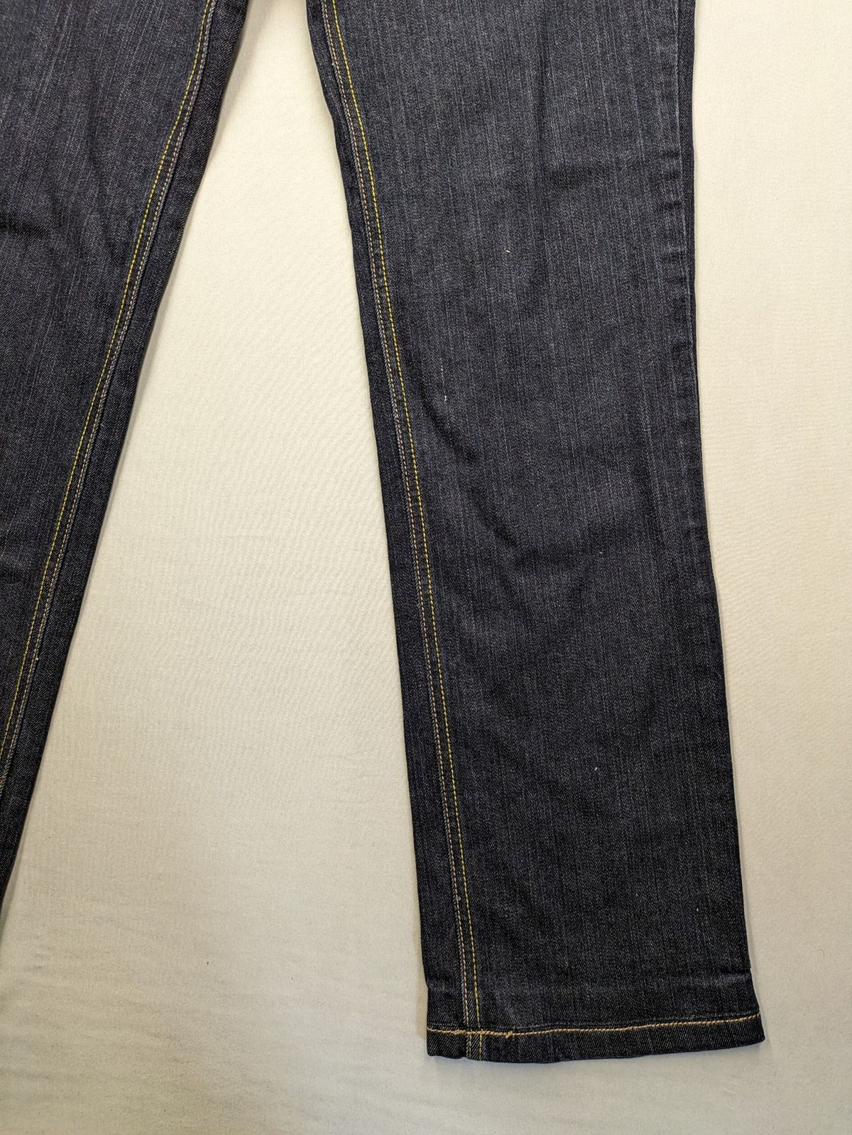 Furore blue straight jeans with yellow contrast stitching and zipper details.
