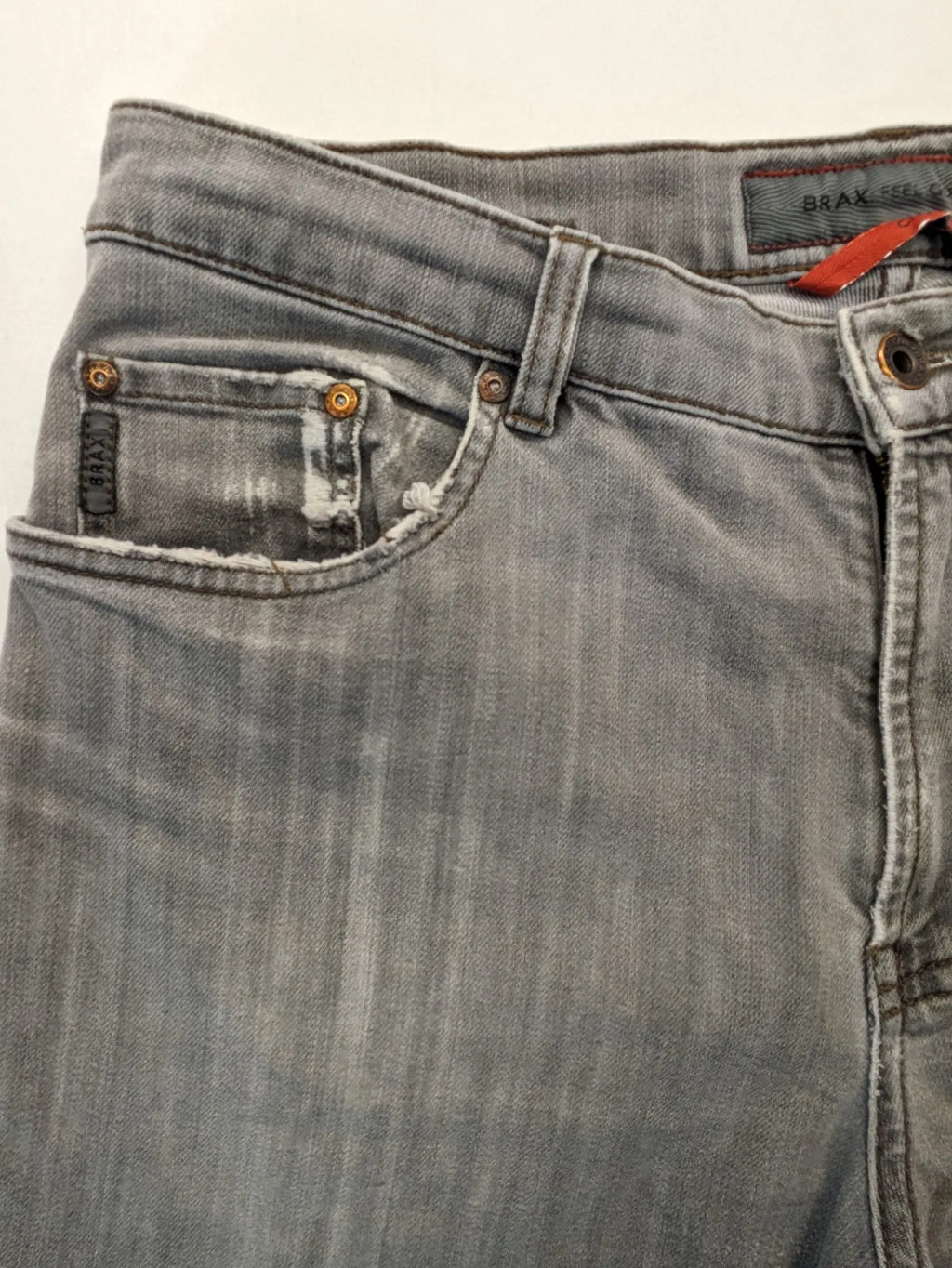 BRAX grey straight jeans with classic 5-pocket style and washed denim finish.