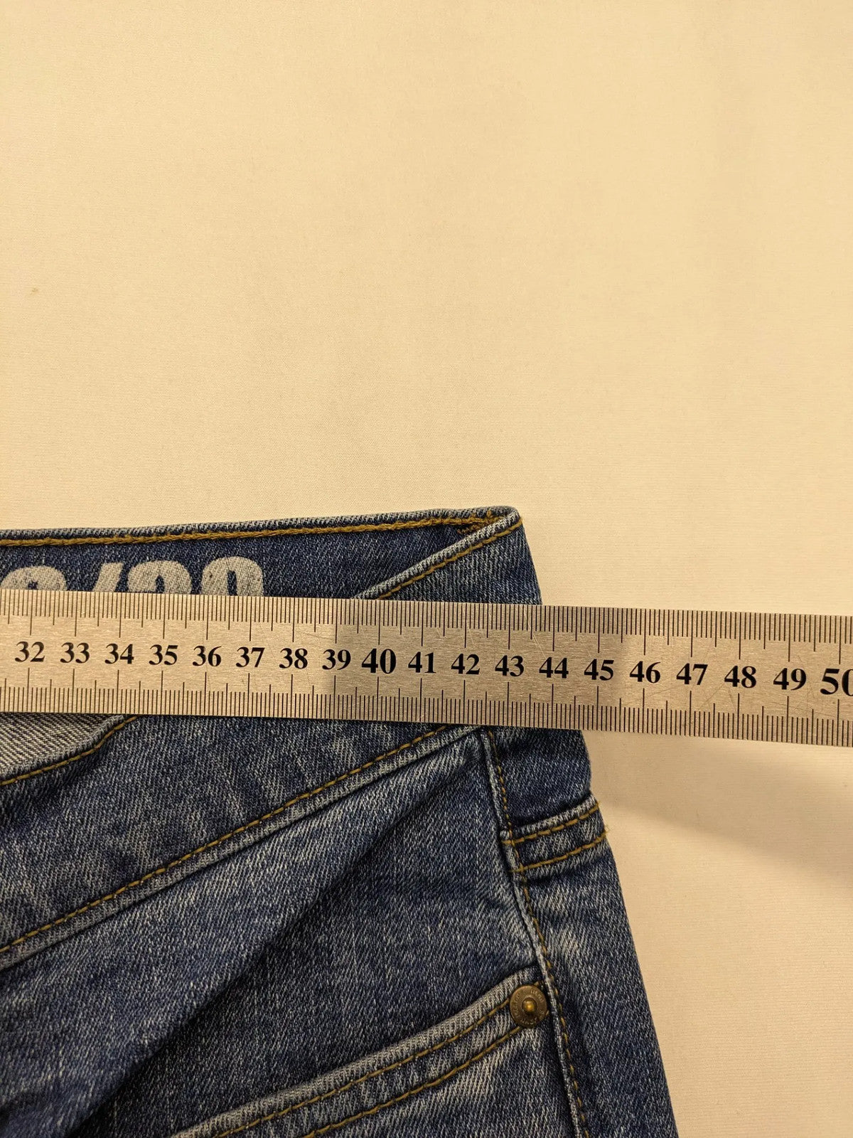 Hero By John Meddox blue straight jeans with five-pocket design and zip fly.