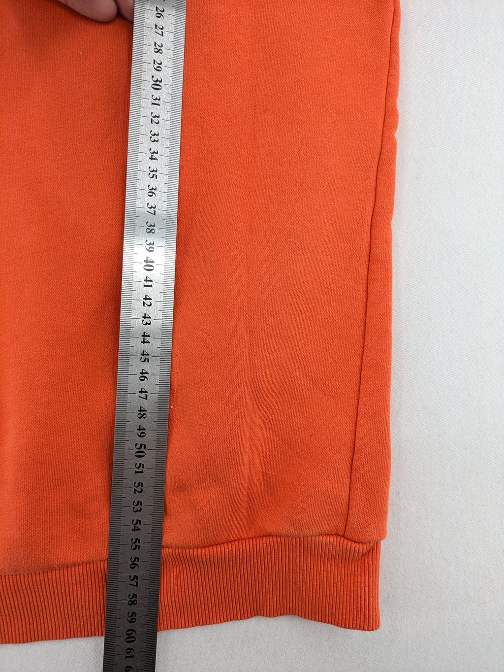 Ginatricot orange hoodie with embroidered winking eye detail, soft material, classic fit.