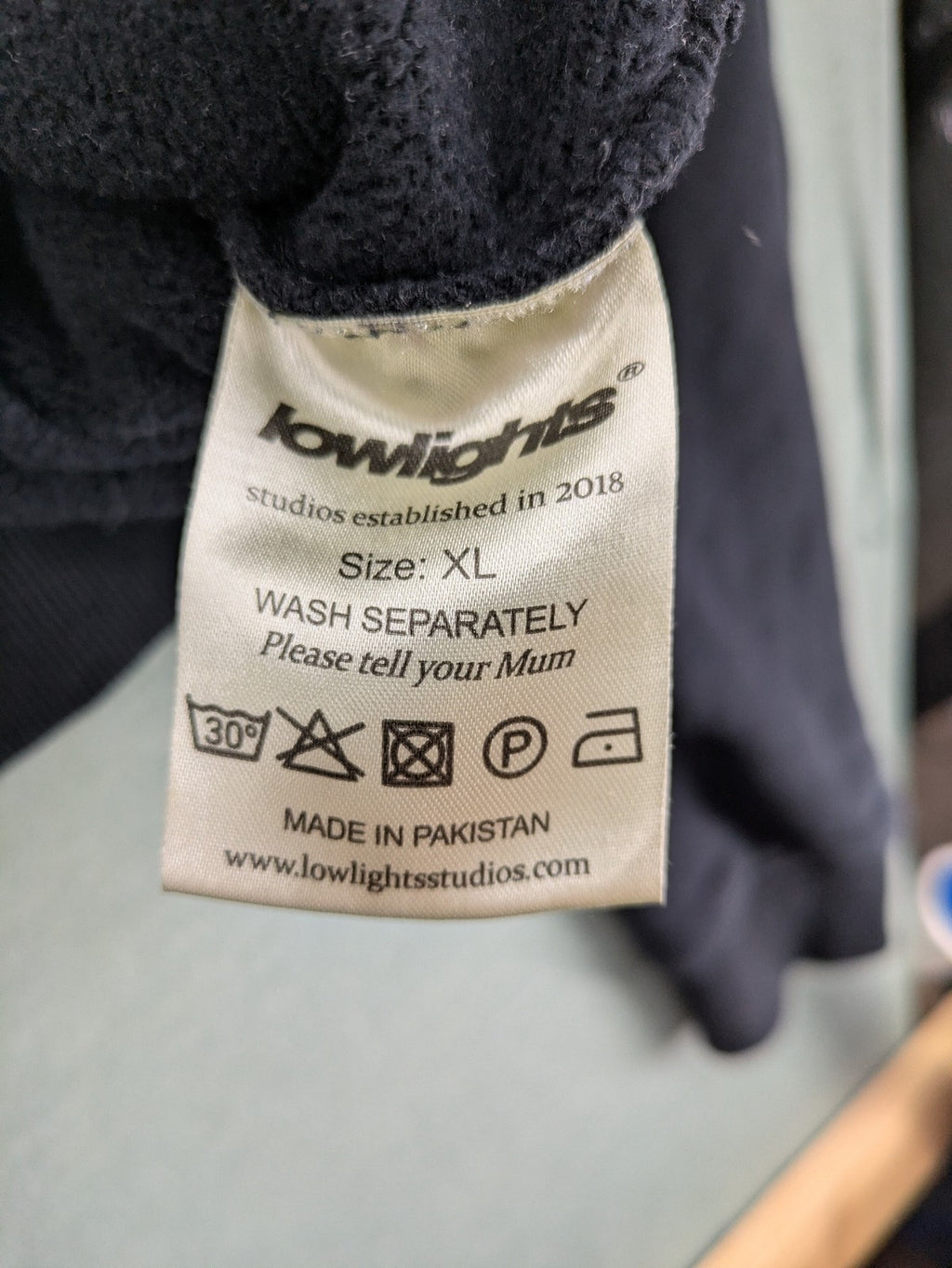 Lowlights Studios grey hoodie with embroidered logo and kangaroo pocket, 100% cotton.