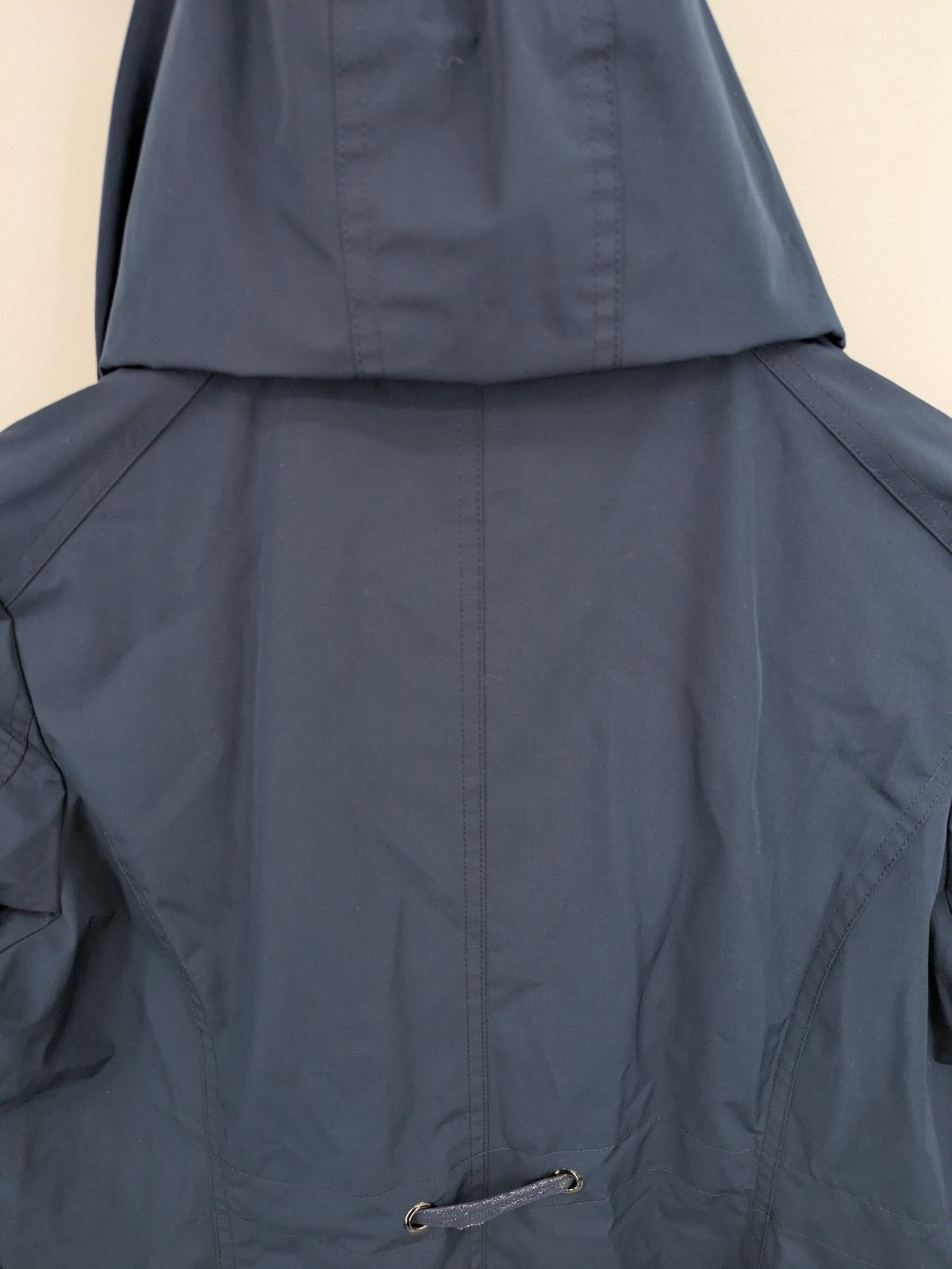 everYou navy parka jacket with hood, adjustable drawstring, patterned lining, button closure.