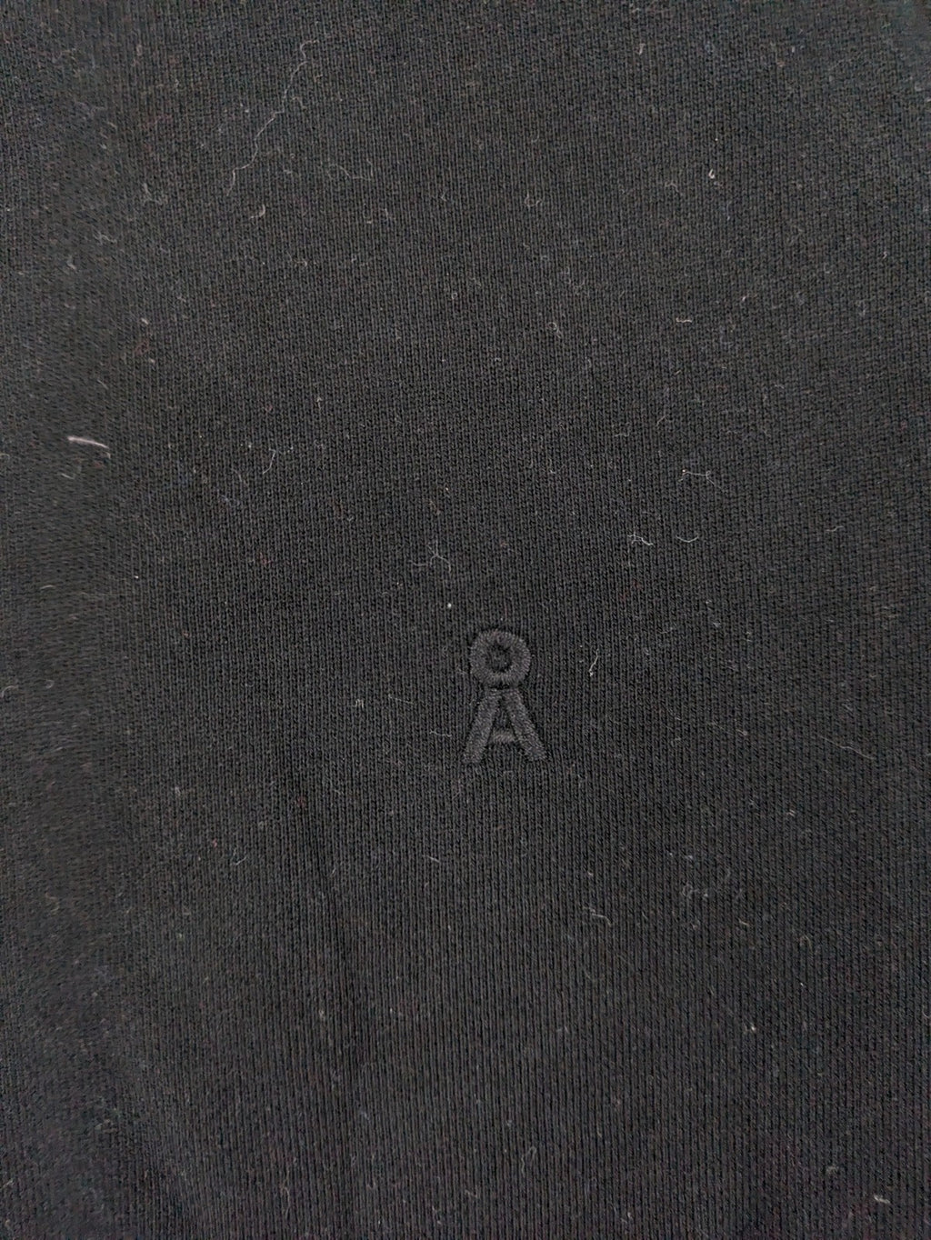 Armedangels black turtle neck jumper with embroidered logo, made from 100% organic cotton.