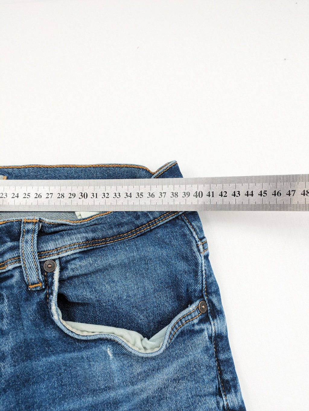 LTB blue straight jeans with low rise, button fly, and classic denim wash.