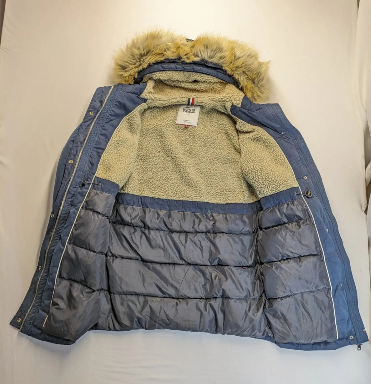 Tommy Hilfiger Denim blue parka coat with faux fur hood and Sherpa lining.