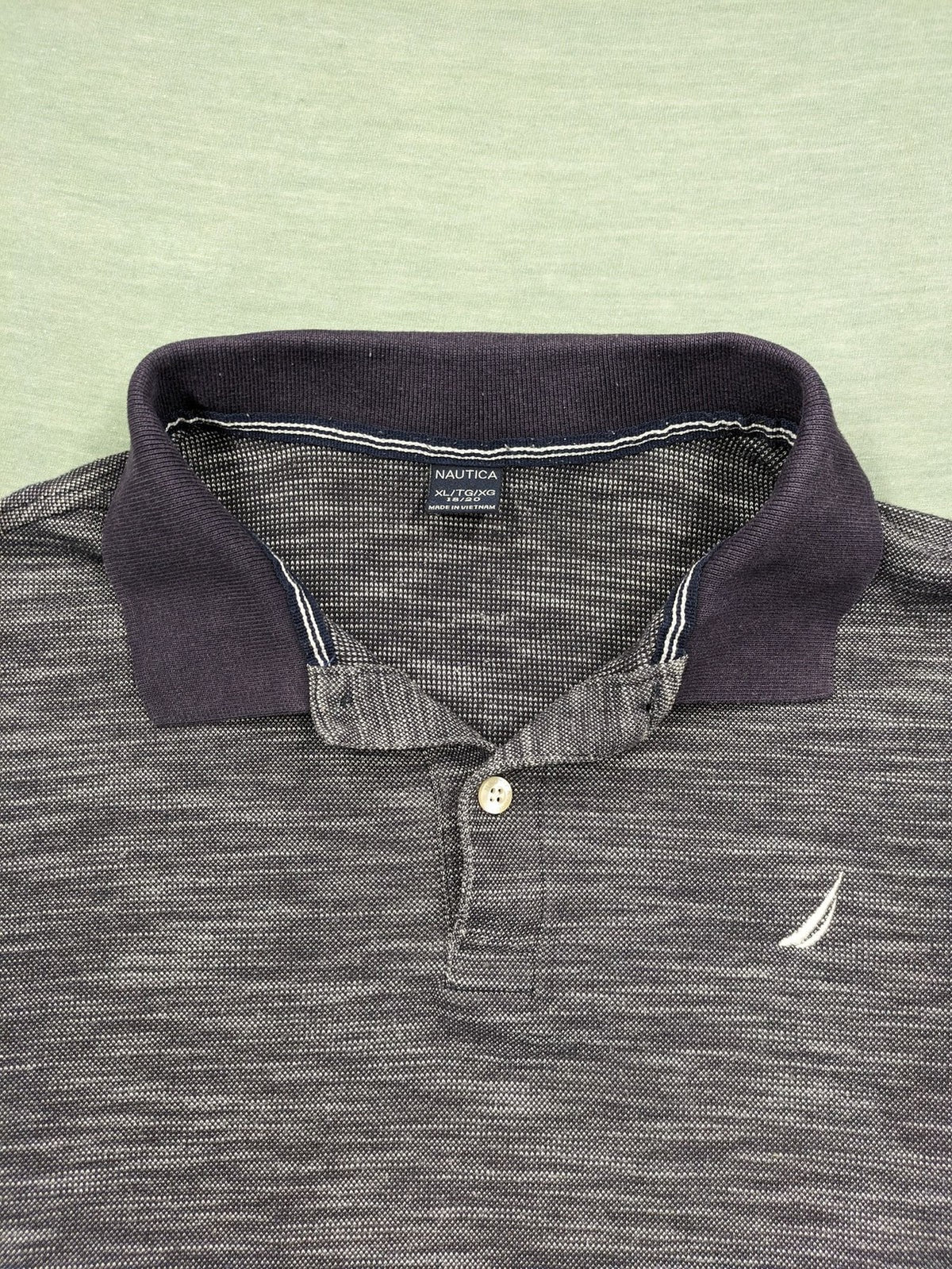 Nautica grey melange polo shirt with contrasting collar and embroidered sail logo.