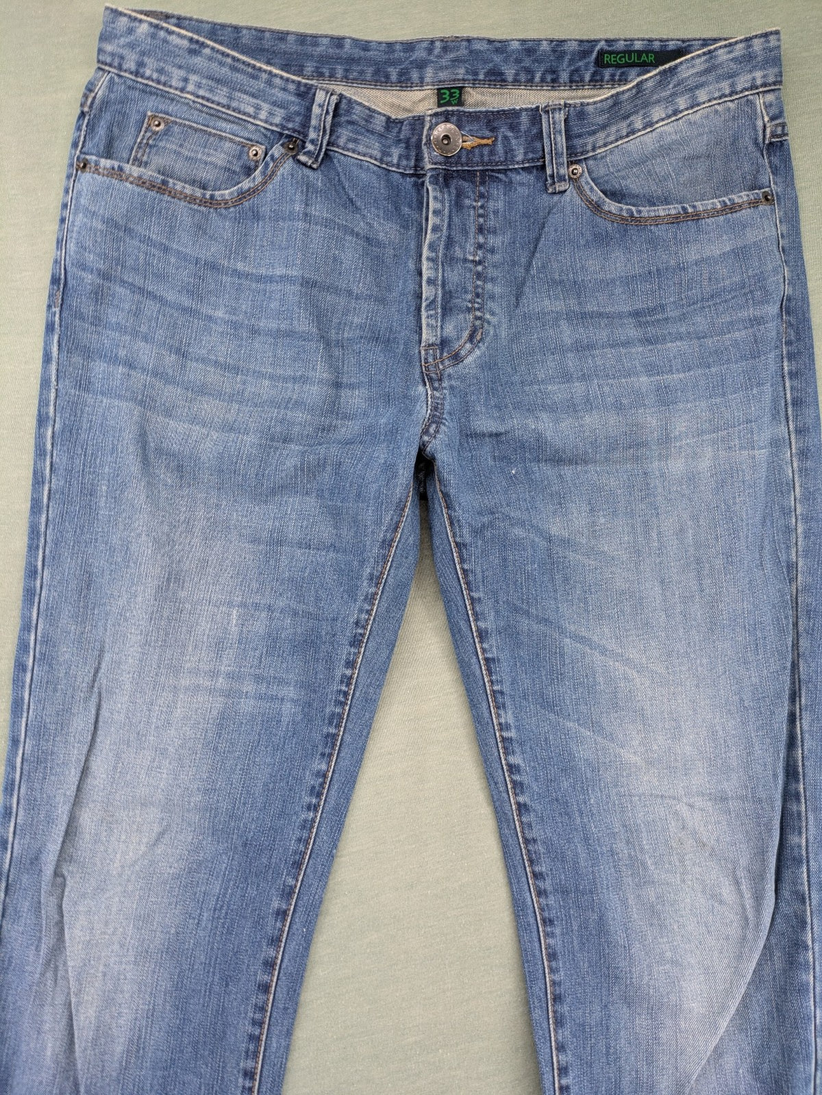 Benetton Jeans blue straight leg denim with button fly and classic design.