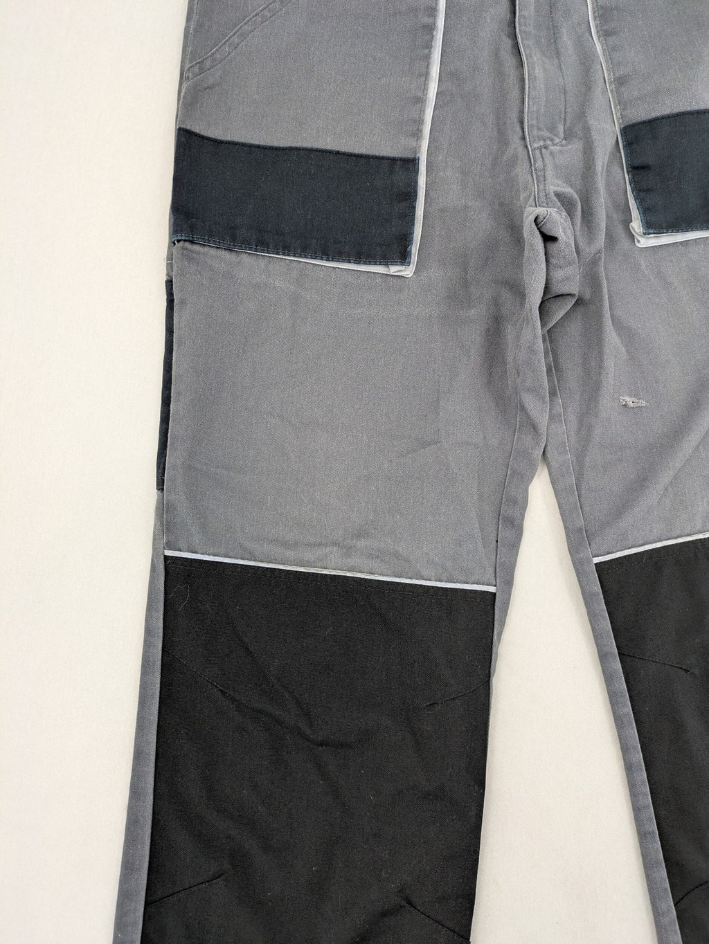 Watsons grey and black hunting tactical pants with Cordura reinforcements and elastic waistband.