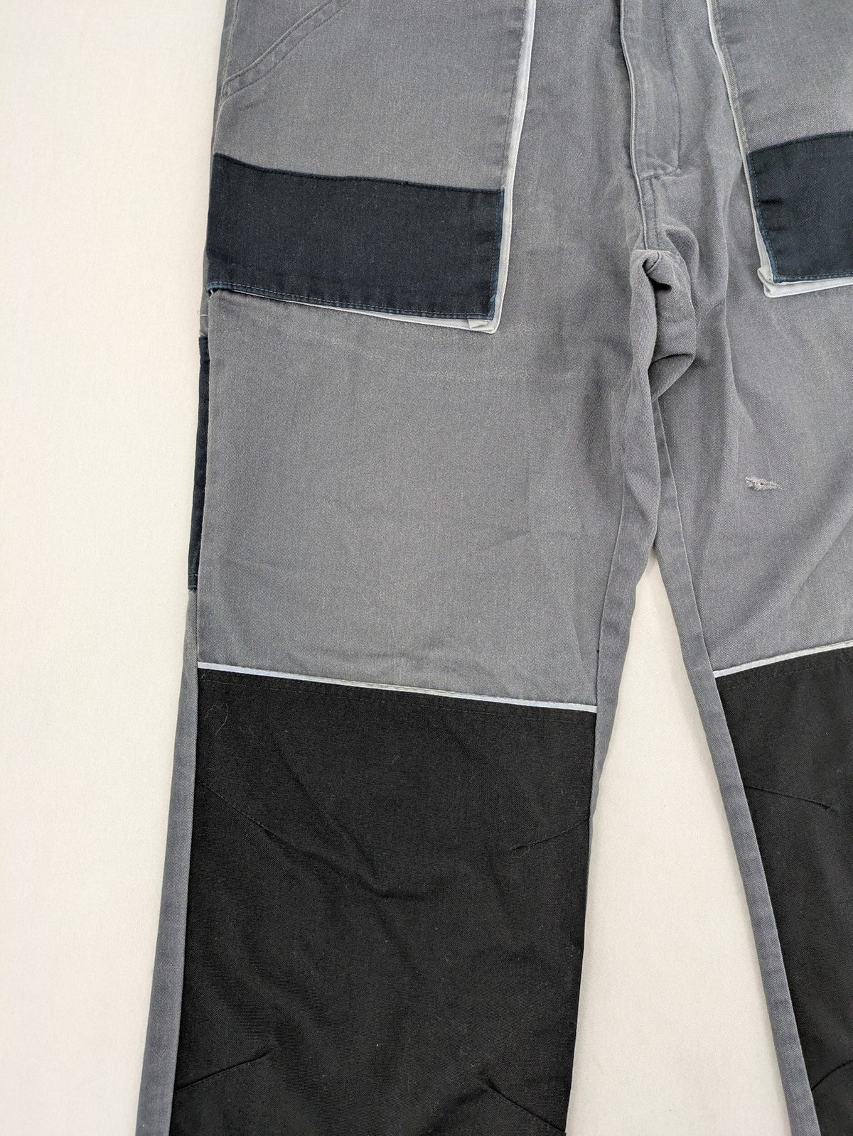 Watsons grey and black hunting tactical pants with Cordura reinforcements and elastic waistband.