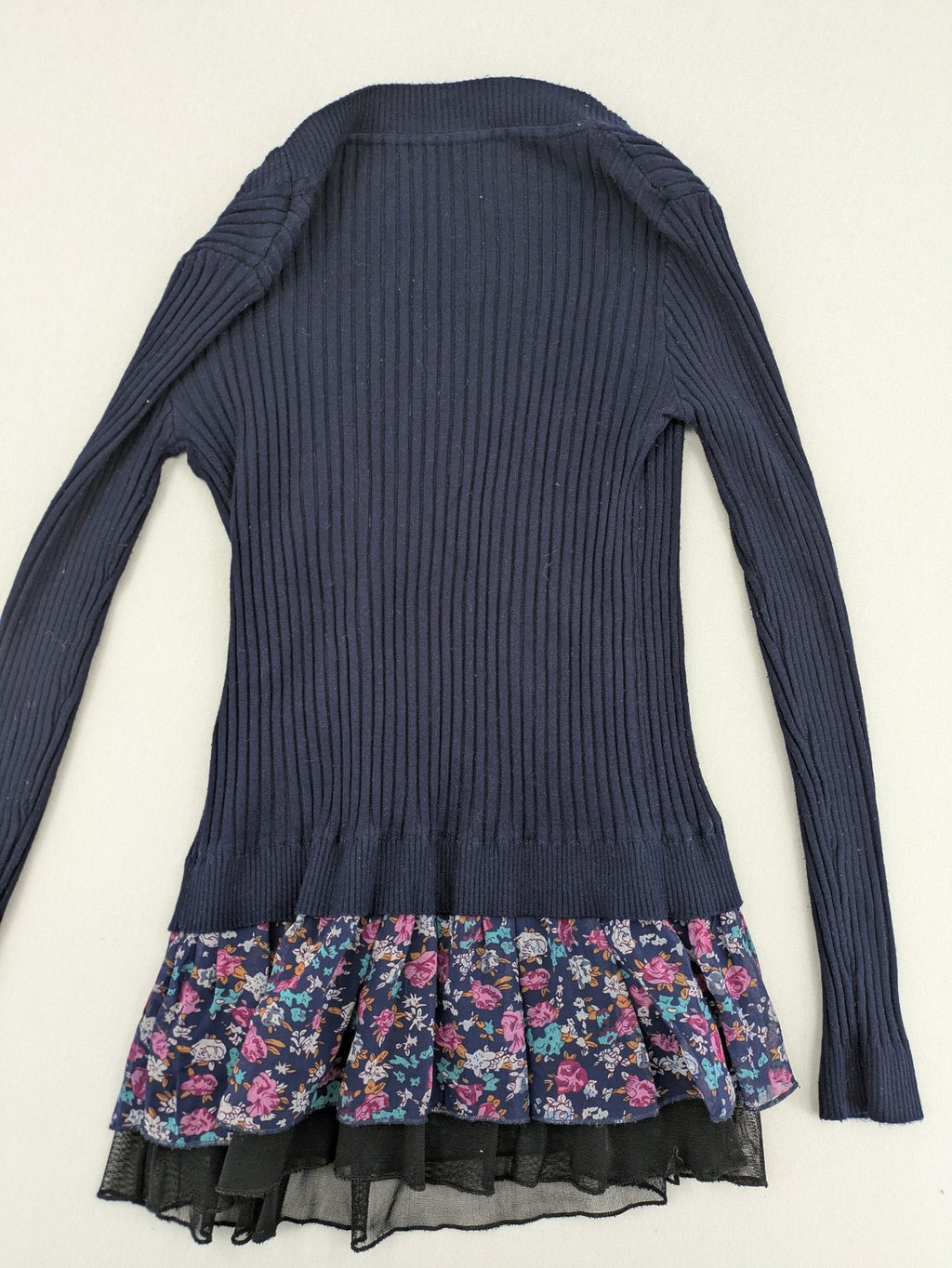 Damen turtle neck jumper dark blue floral ribbed knit with delicate lace hem.
