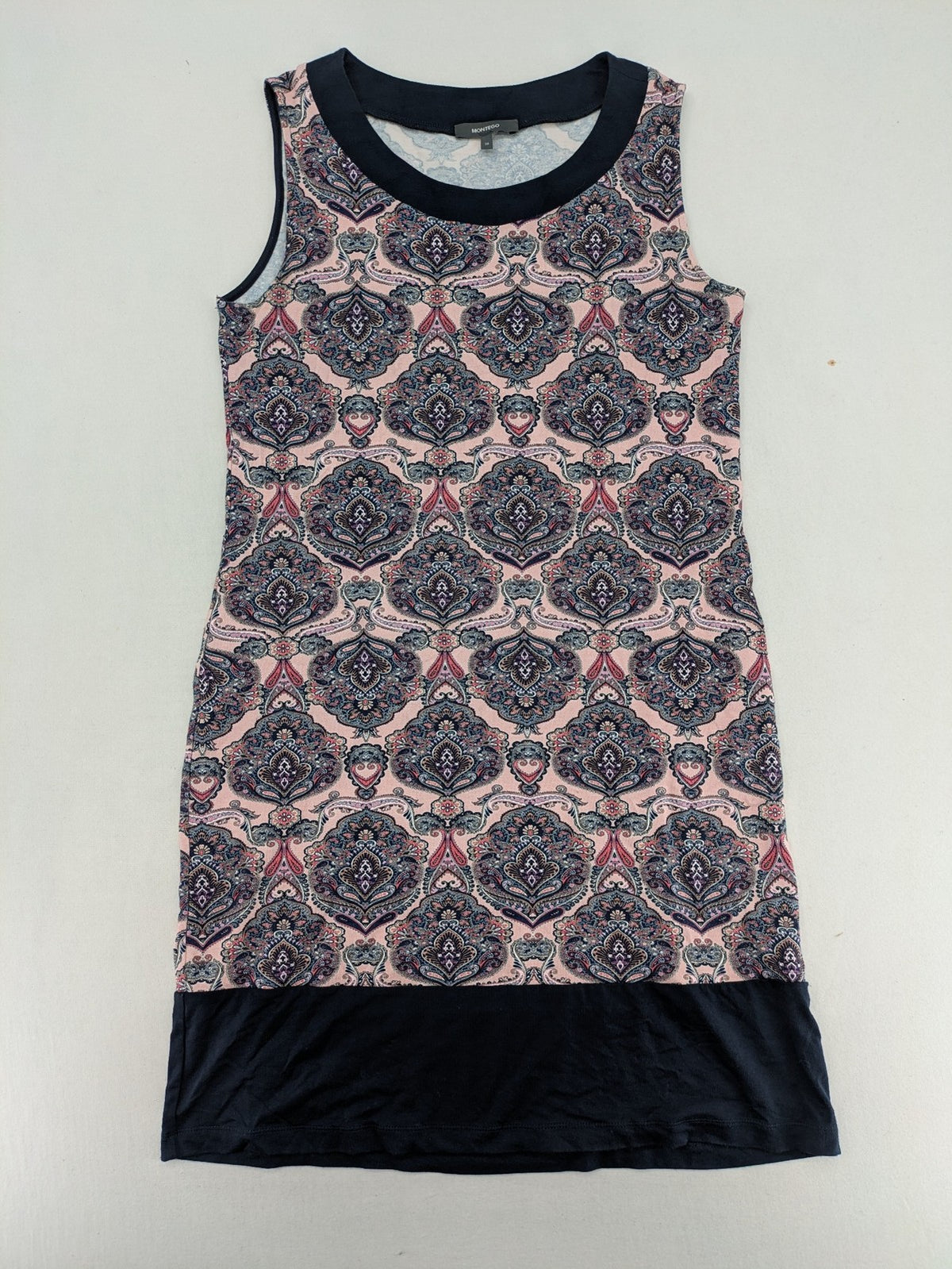 Montego pink sleeveless dress with paisley pattern and black hem, made of viscose.