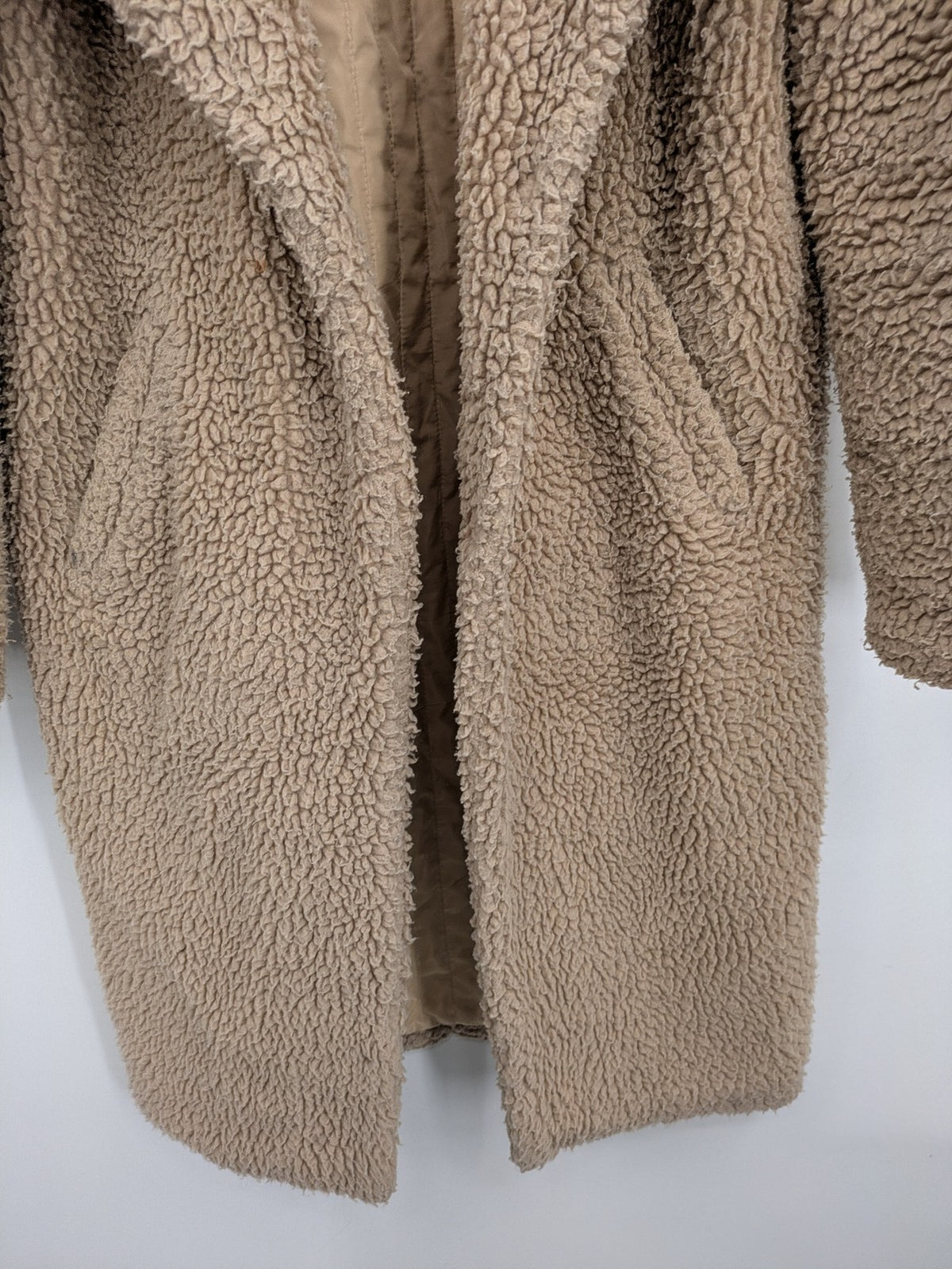 Clockhouse beige teddy coat longline design soft faux fur material with notched collar.