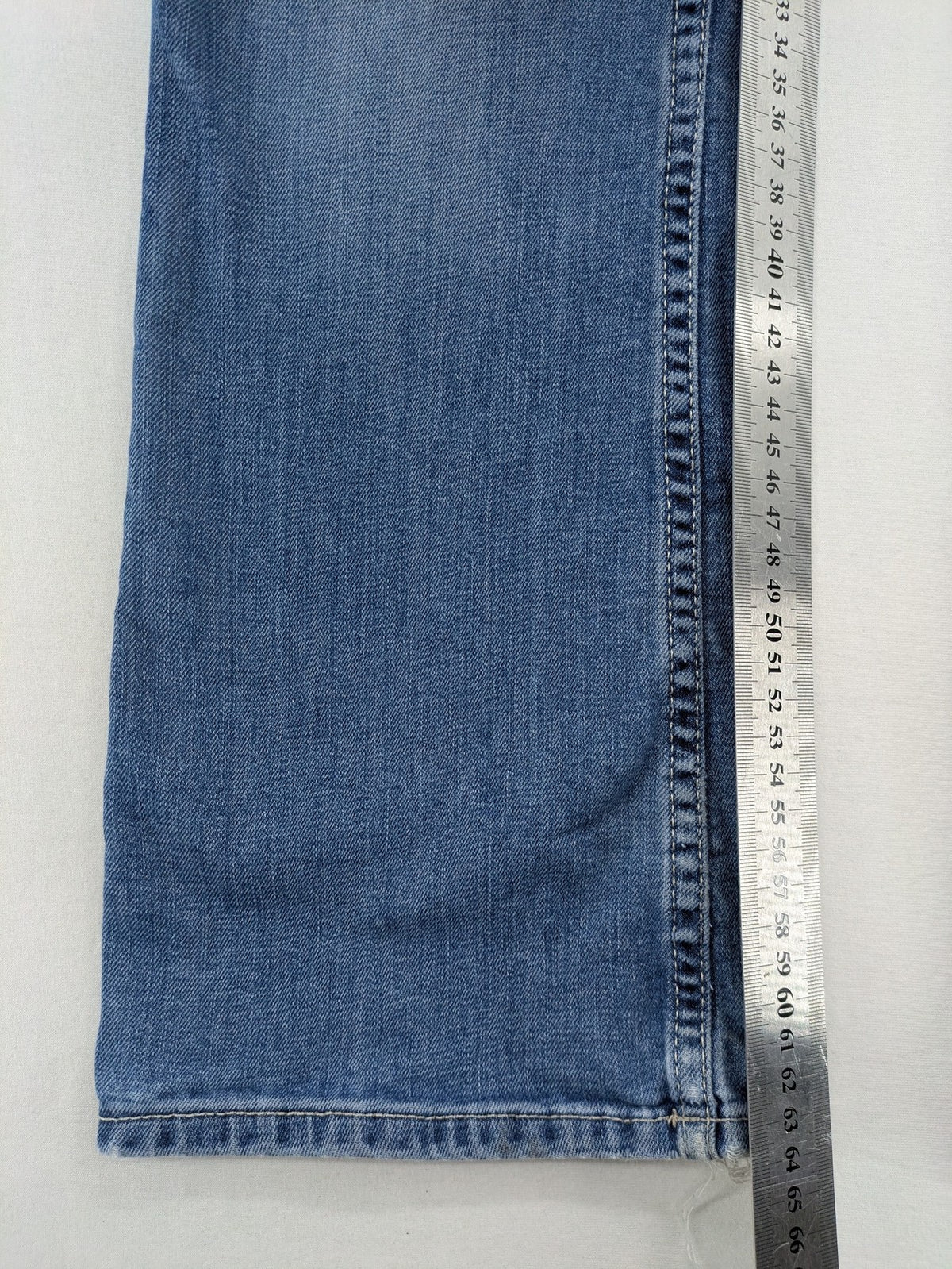 H&M blue bootcut jeans size 146, medium wash, stretch denim material.