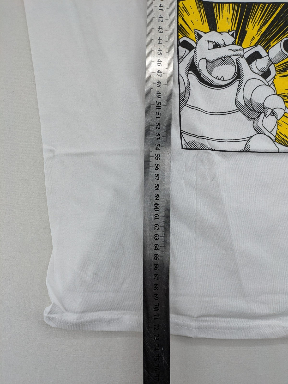 Pokemon graphic t-shirt white comic print featuring Pikachu, Charizard, Blastoise, Venusaur.
