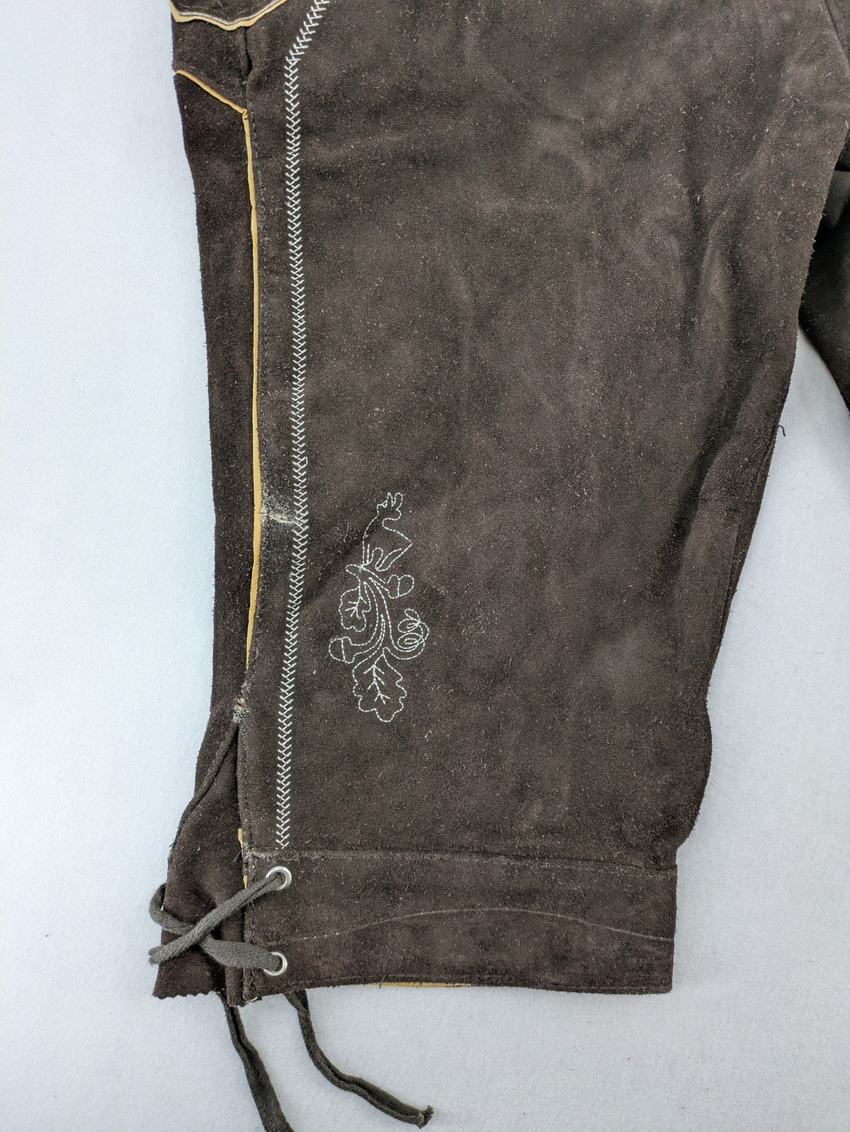 Braun traditional leather pants brown suede with intricate embroidery on bib and legs.
