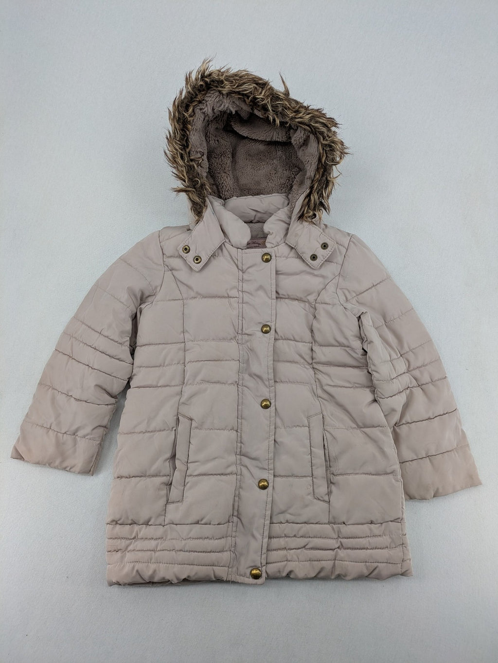 Brit Island beige puffer coat with fleece lining and faux fur hood detail.