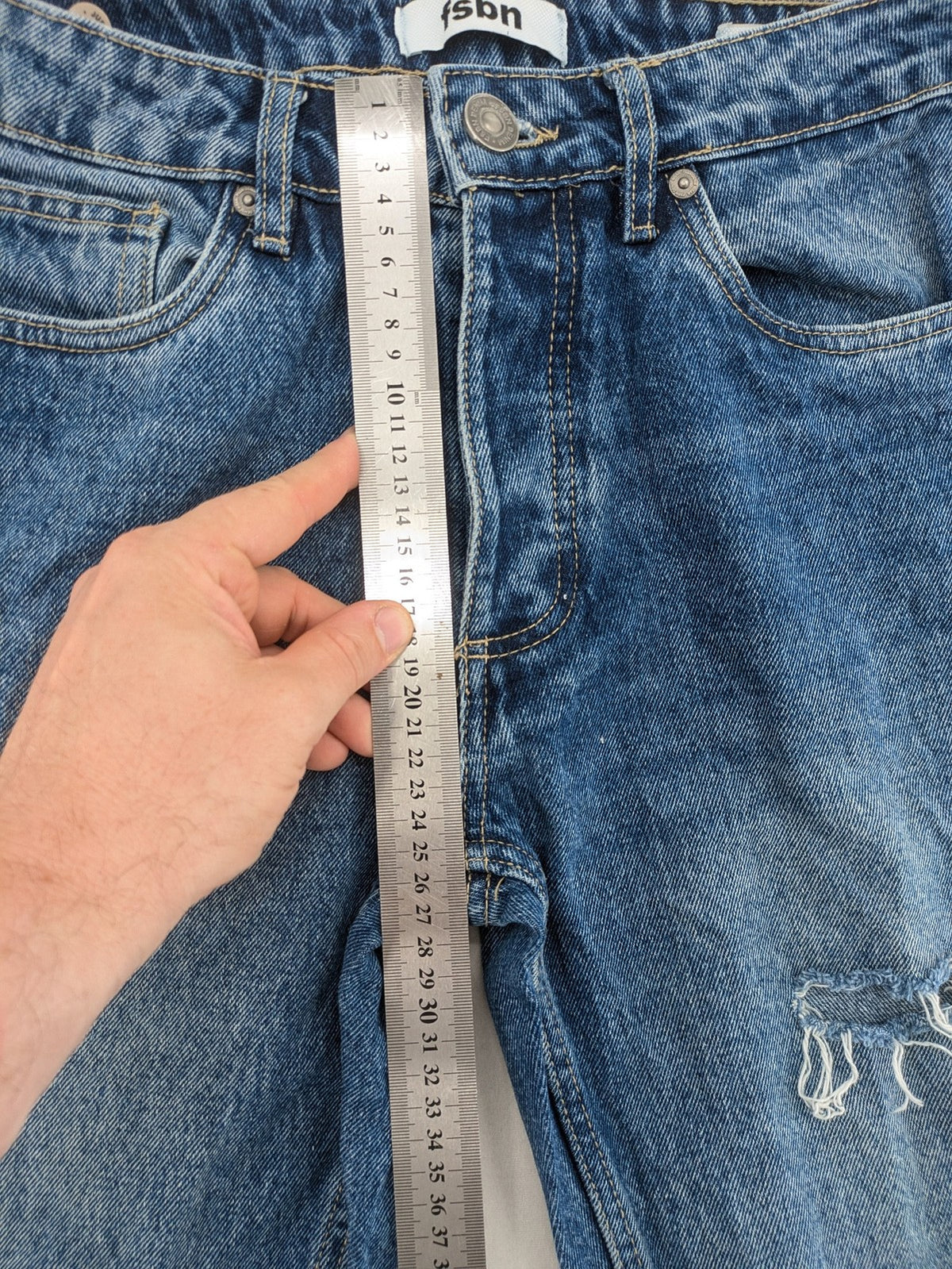 FSBN blue straight jeans with distressed knee rips and classic button fly.