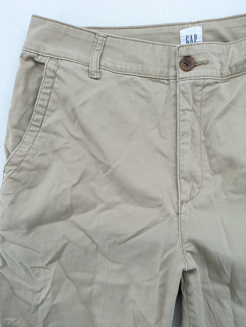 Gap beige girlfriend chino pants with relaxed fit and soft cotton-stretch blend.