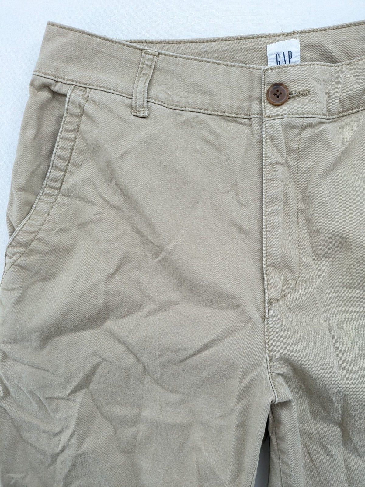 Gap beige girlfriend chino pants with relaxed fit and soft cotton-stretch blend.