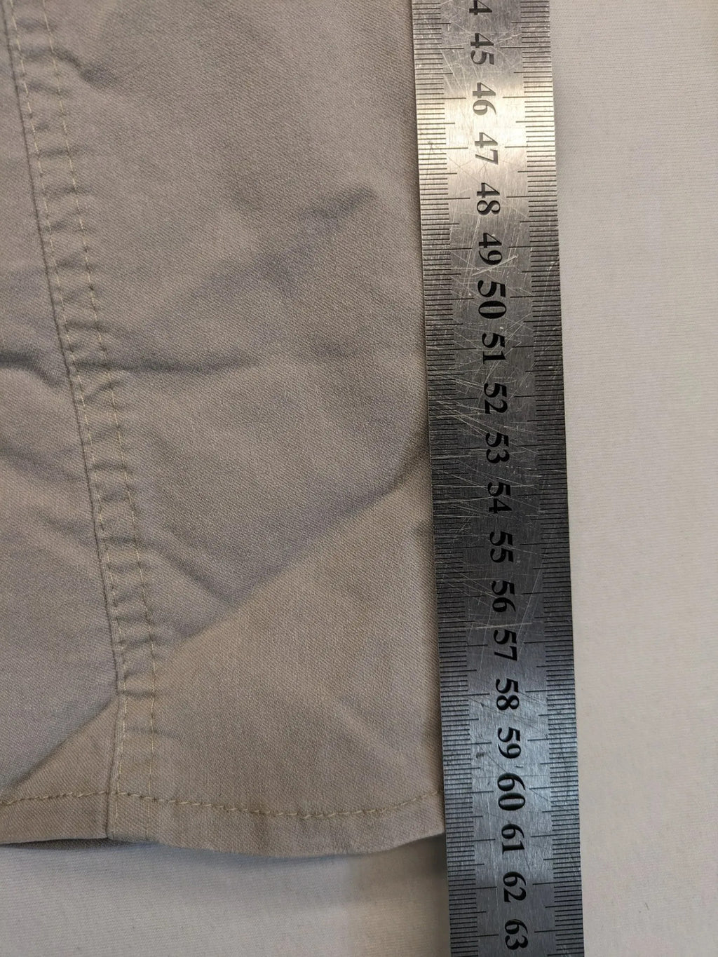 Cherry Berry khaki capri pants with elastic waistband and decorative buttons, featuring logo and zip pockets.