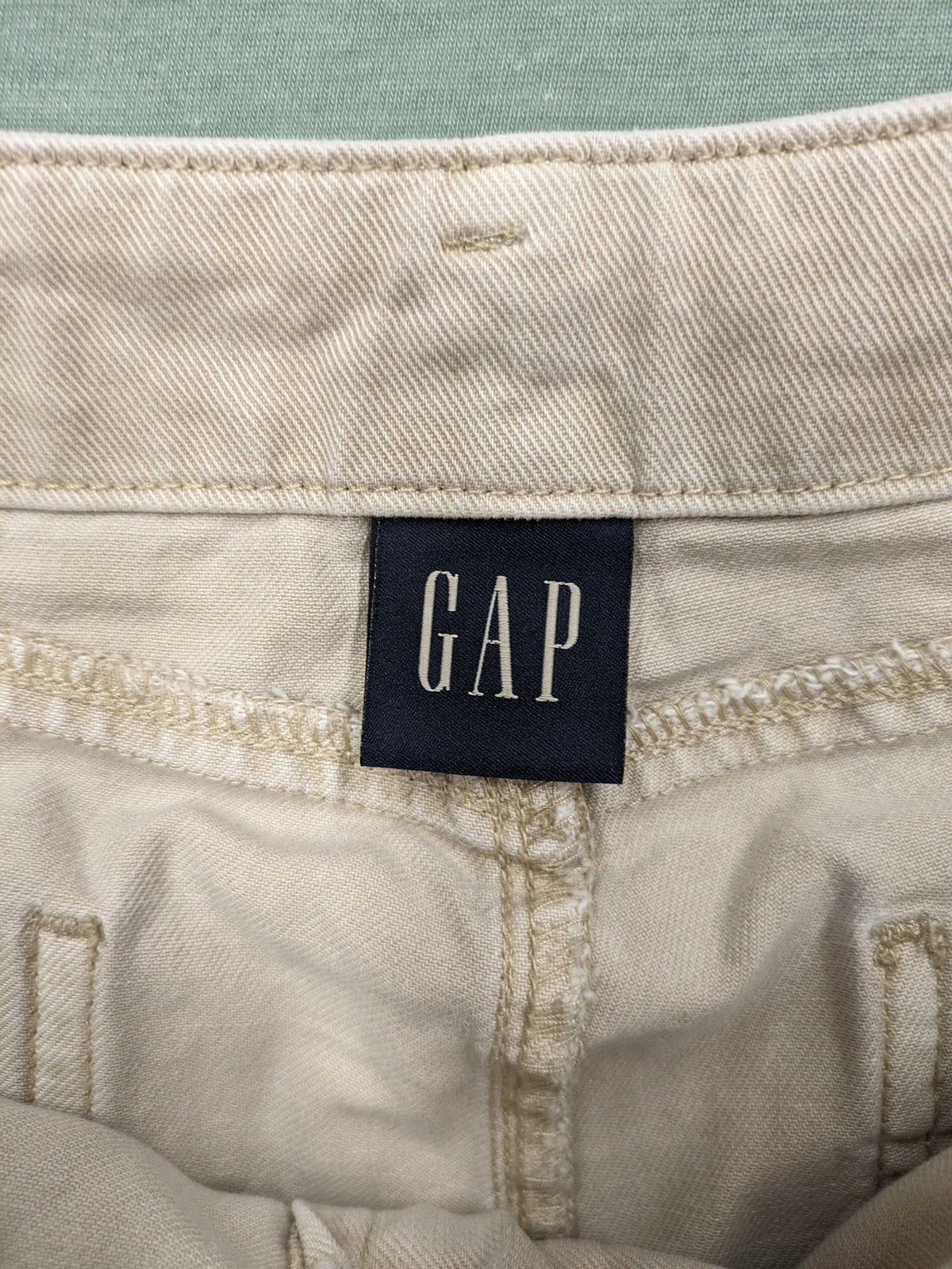 Gap beige loose-fit chino pants made from 100% cotton with relaxed wide-leg design.