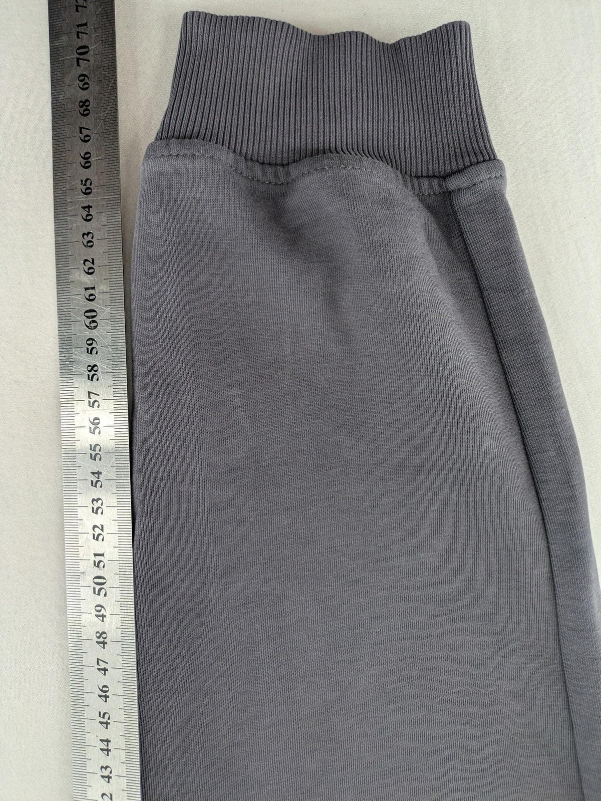 US Polo Assn grey sweatpants with light green drawstring and subtle logo detail.