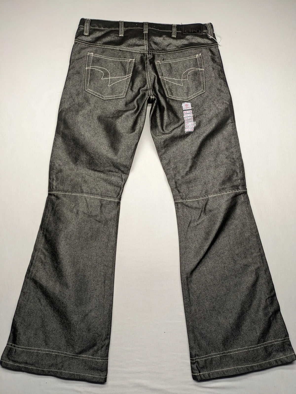 CIPO grey bootcut biker jeans with white contrast stitching and moto-inspired knee pleats.