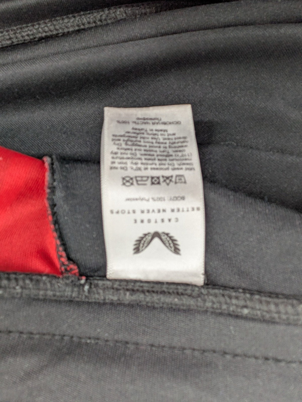 Bayer black training shorts with red side stripes, embroidered team crest and Castore logo.
