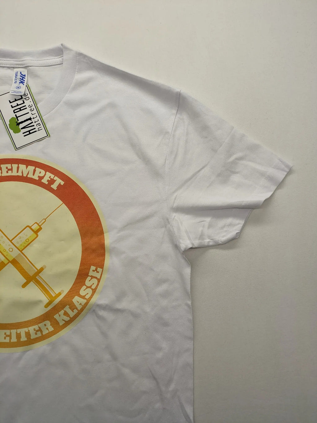 Hattree orange and white T-shirt with graphic print "Ungeimpft Mensch Zweiter Klasse".