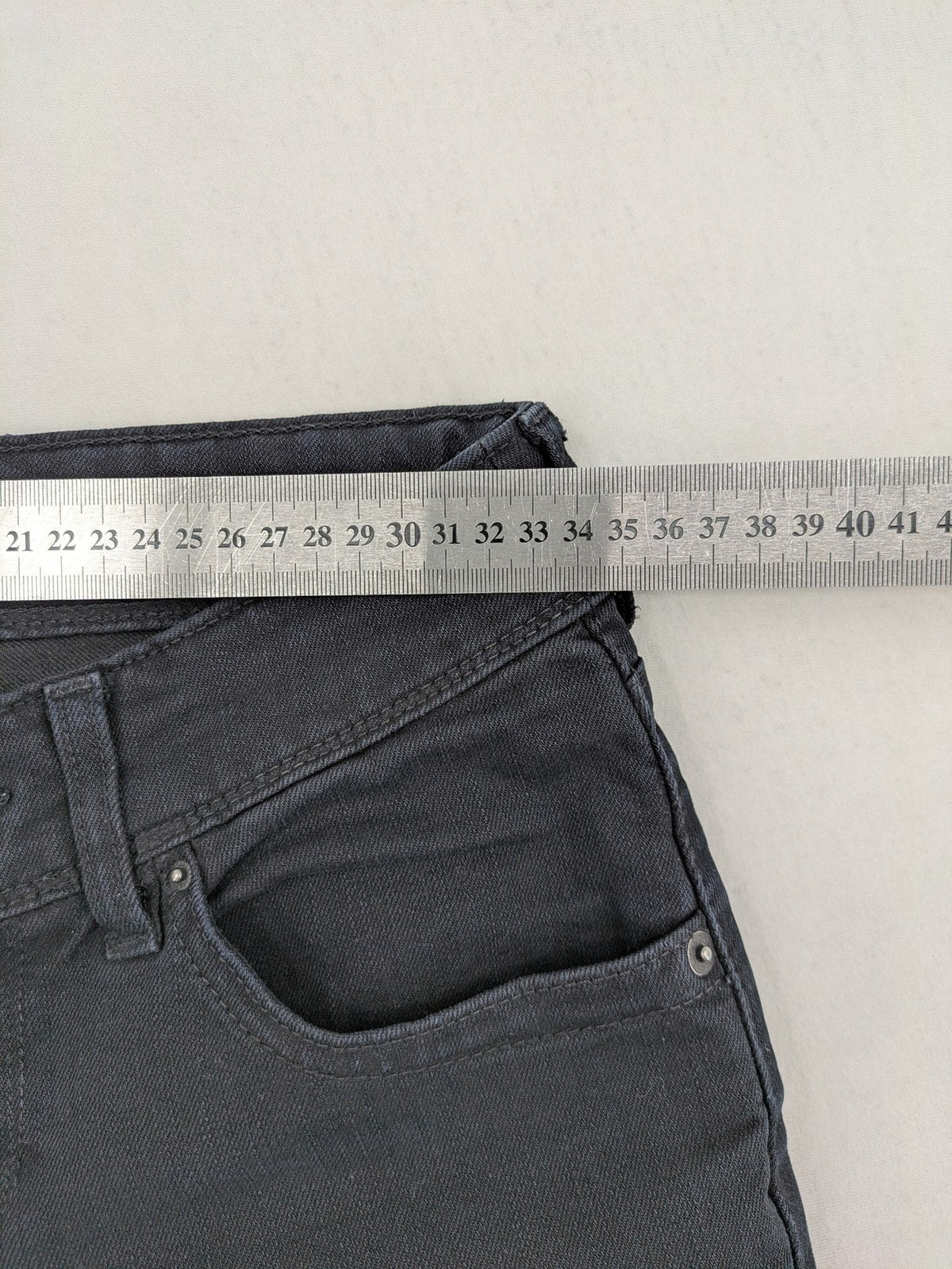 Levi's black slim fit jeans with classic 5-pocket design and zipper fly.