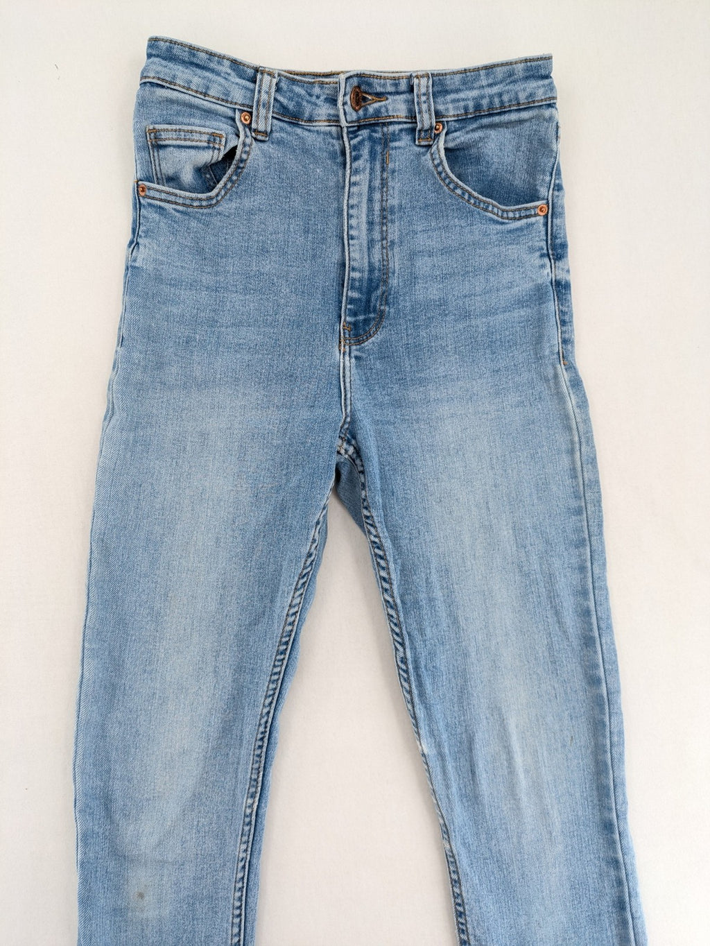Bershka blue super high waist skinny jeans with washed denim finish and zip closure.