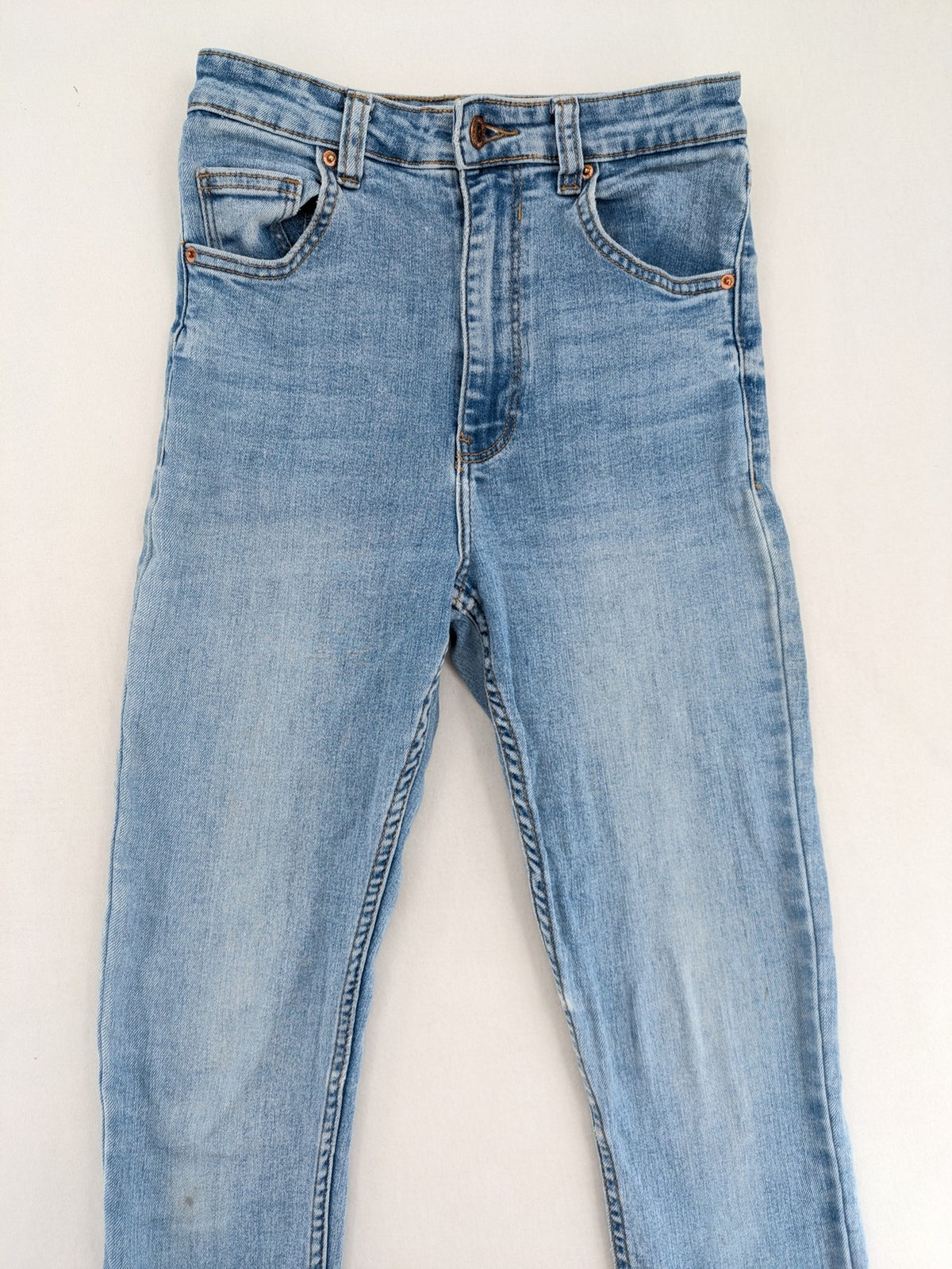Bershka blue super high waist skinny jeans with washed denim finish and zip closure.