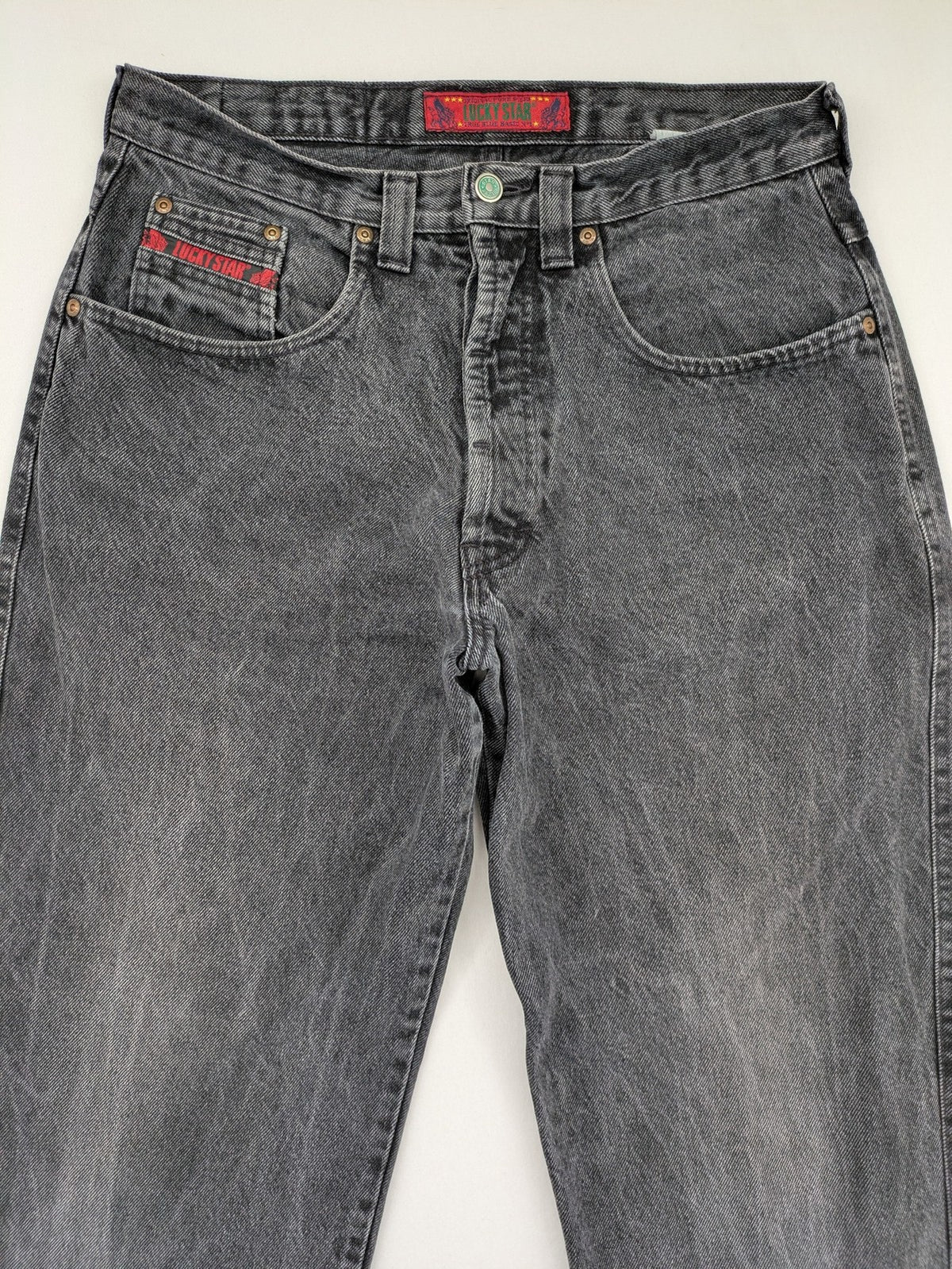 Lucky Star grey tapered high waist jeans with faded wash and red logo details.