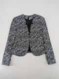 H&M Divided black and white patterned blazer with open front and two front pockets.