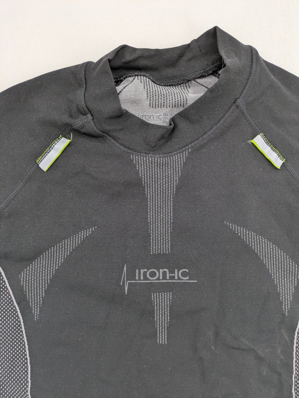 Iron-ic black long sleeve baselayer top with standing collar and thumbholes.