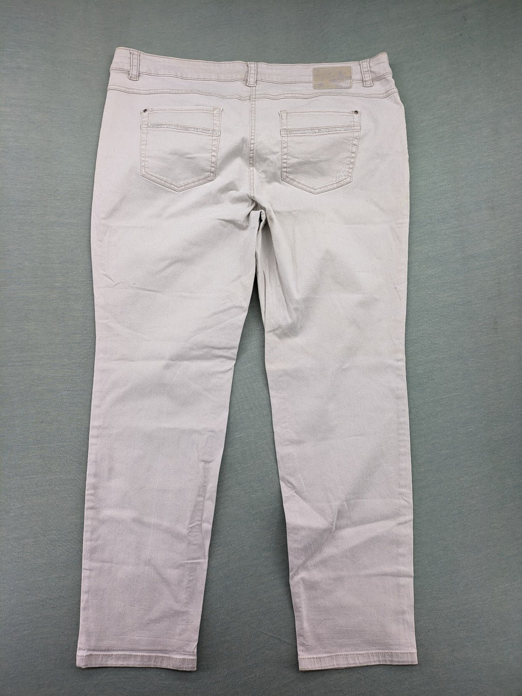 Canda beige straight jeans with strass details and classic five-pocket design.