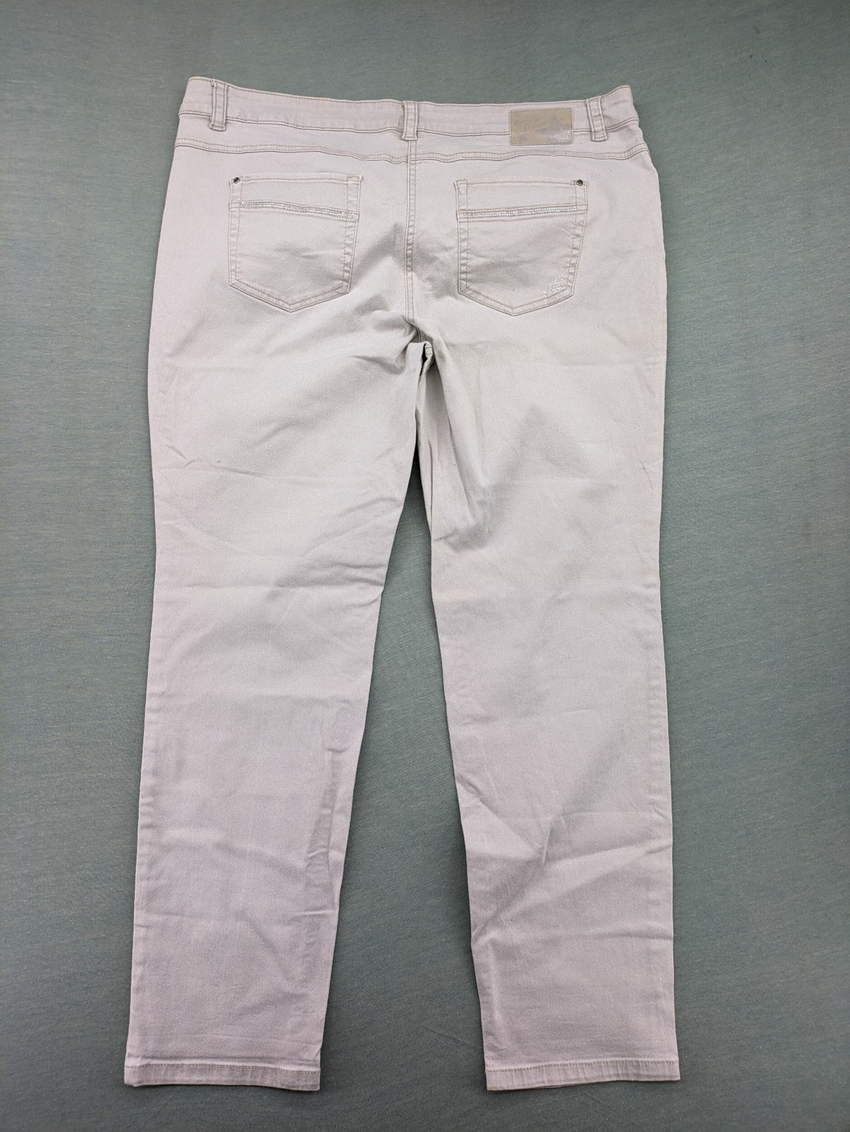 Canda beige straight jeans with strass details and classic five-pocket design.