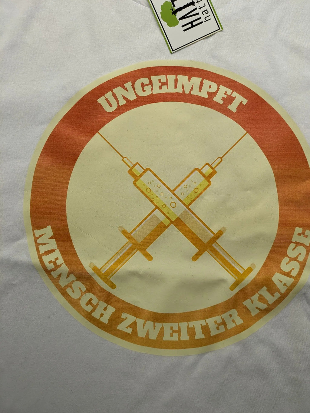 Hattree orange and white T-shirt with graphic print "Ungeimpft Mensch Zweiter Klasse".
