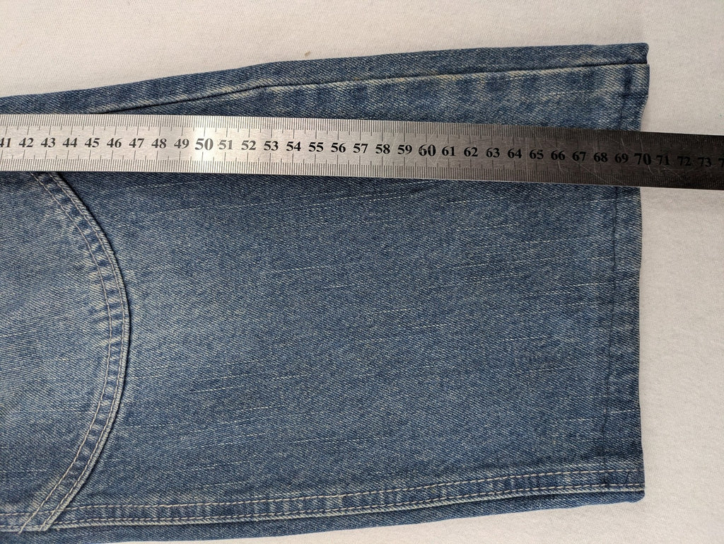 John F. Gee blue straight jeans with reinforced knees and durable denim material.
