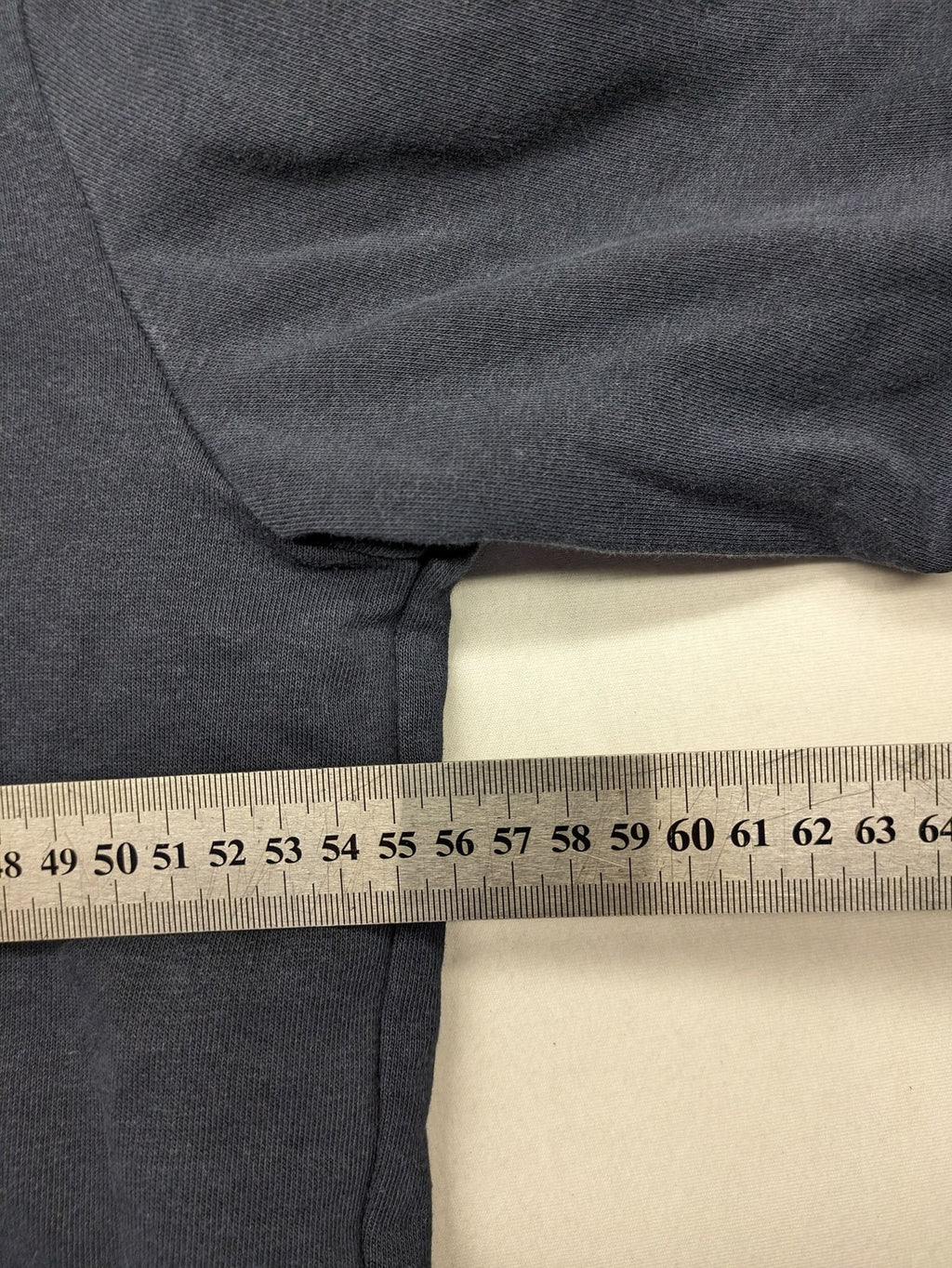Quiksilver grey hoodie with logo graphic, kangaroo pocket, and adjustable hood.
