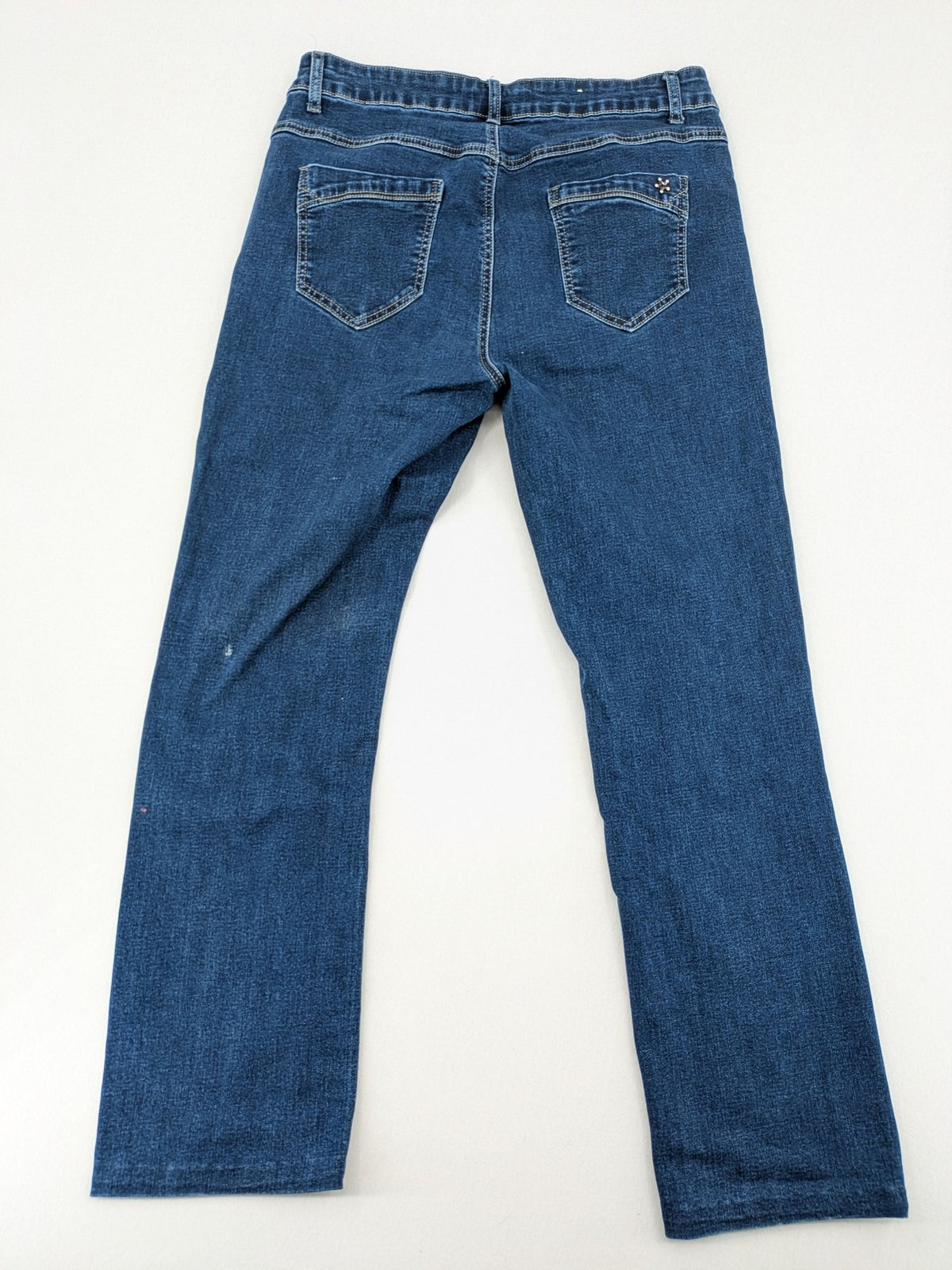 Miss Good blue straight jeans with 5-pocket design and decorative metal accent.