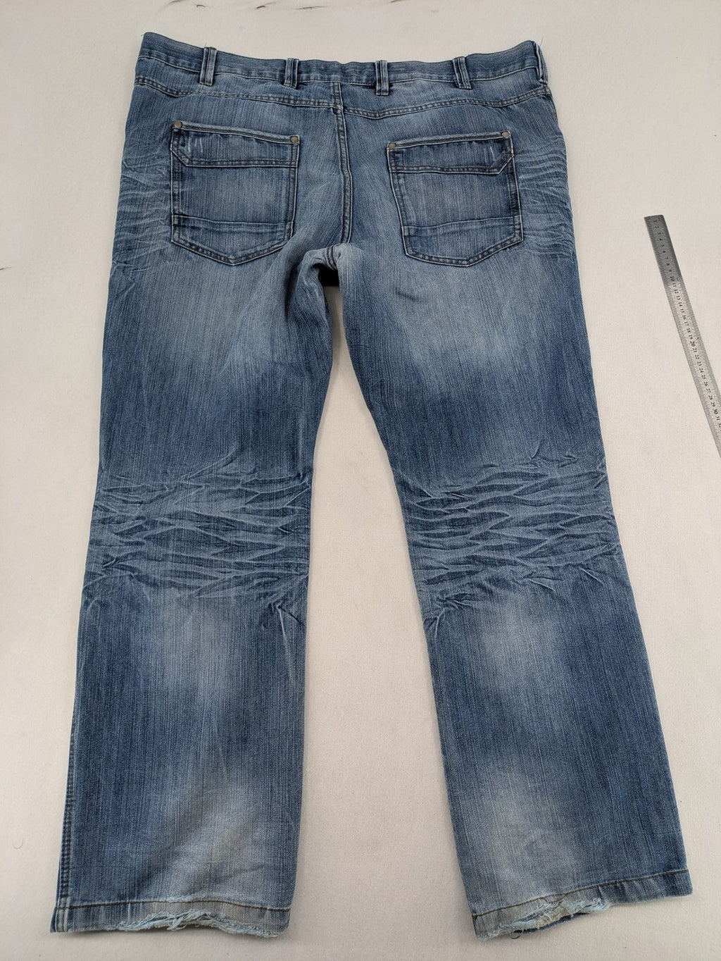Premium Denim blue straight leg jeans with biker knee inserts and five-pocket design.