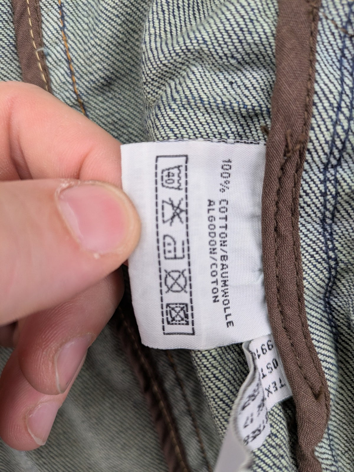 Authentic Clothing Company blue jeans blazer with contrast stitching and button closure.