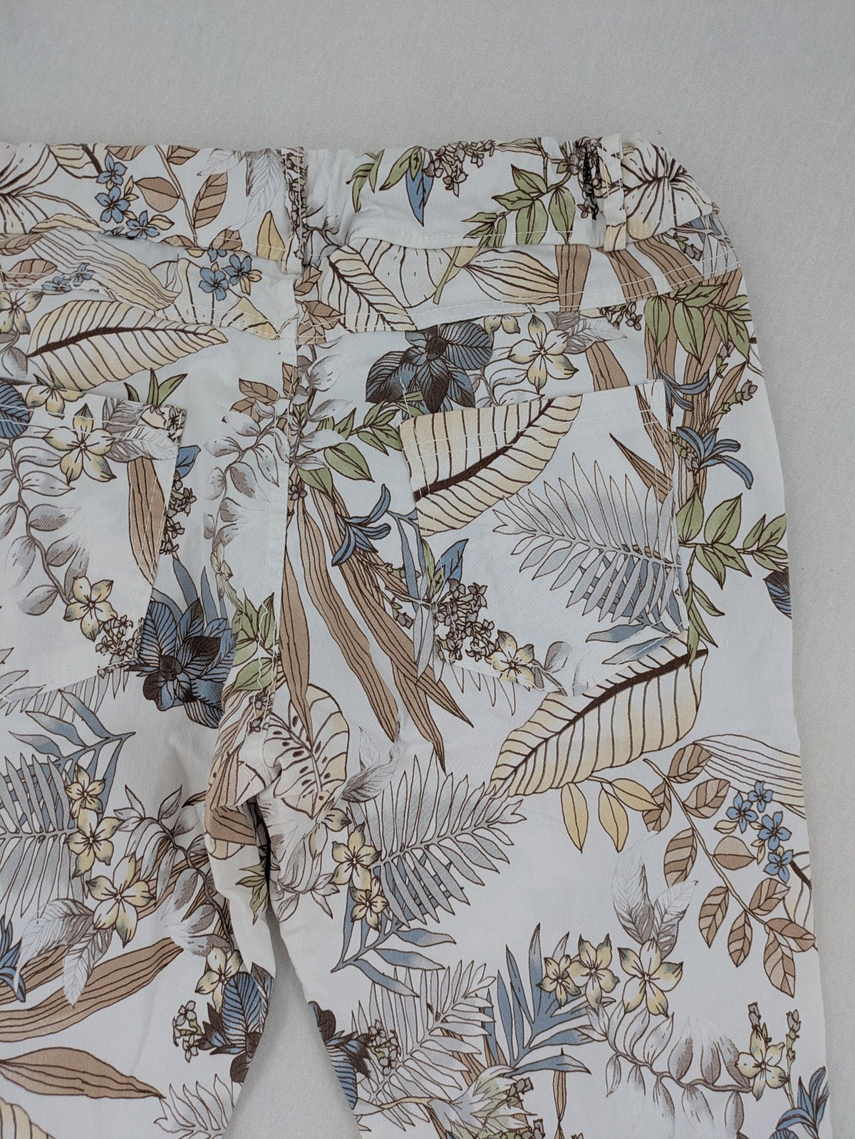 Made in Italy multi pants tropical floral pattern cotton-viscose blend on white background.