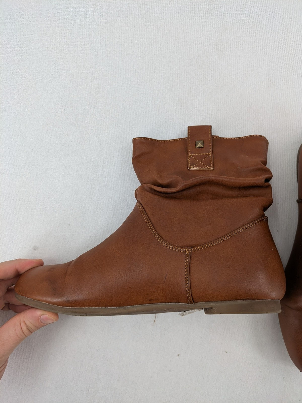 Van Hill brown ankle boots with slouchy design, fold-over cuff, and soft lining.