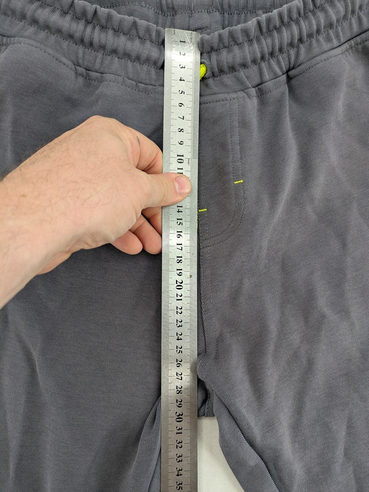 US Polo Assn grey sweatpants with light green drawstring and subtle logo detail.